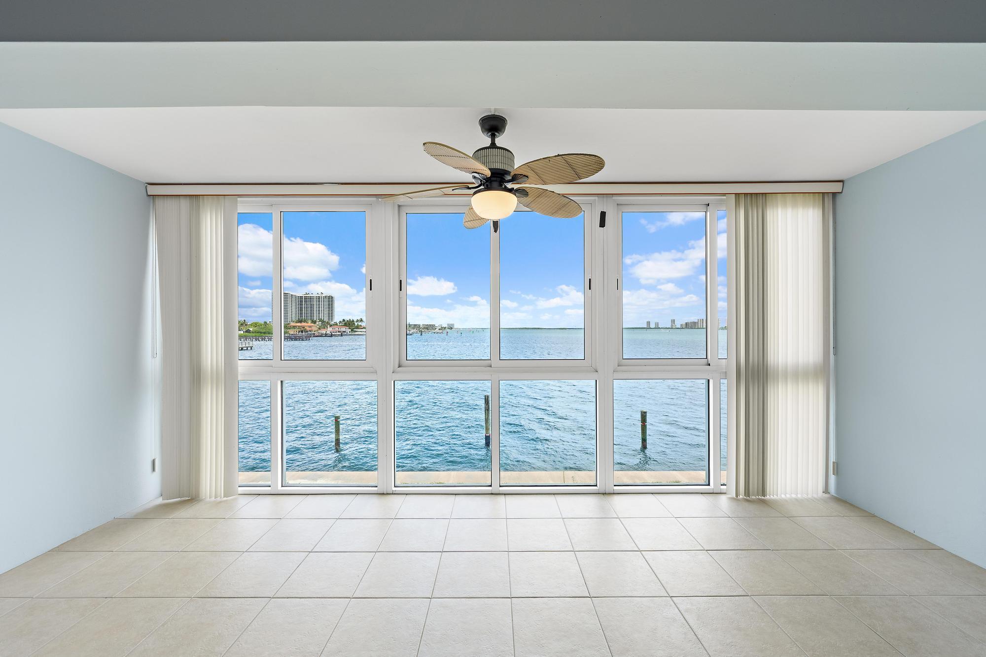 Your own piece of waterfront paradise awaits in this beautifully refreshed second-floor condo located in a gated Intracoastal community. Wide water views welcome you from the moment you walk in, with extended living flowing into the impact glass enclosed balcony, the perfect place to relax and unwind. This bright residence features an open kitchen with maple cabinetry, granite countertops, breakfast bar seating, and ample storage. Recent updates include fresh 2026 paint, new carpeting, partial impact windows, and a new roof (2025). The spacious bedroom offers double closets. Community amenities include a heated waterfront pool, Intracoastal grilling area, laundry on each floor, assigned parking, and additional storage. Investor friendly with immediate rental potential.