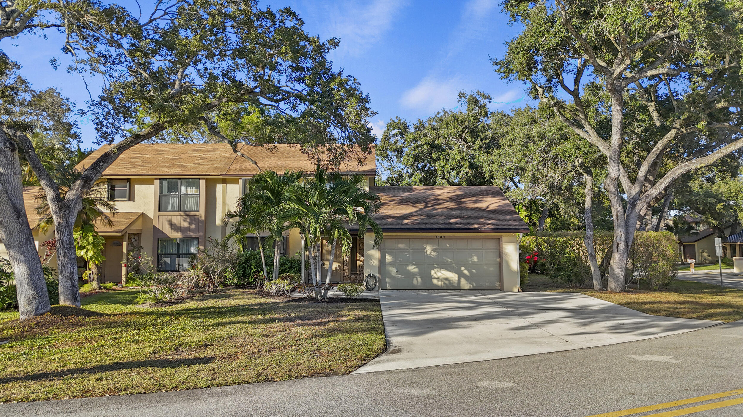 Wonderful opportunity to own an affordable townhome in the heart of Palm Beach Gardens. This move-in-ready residence features a spacious first-floor layout with an open kitchen and living area, plus a formal dining room and separate family room. Newer luxury vinyl plank flooring runs throughout the entire home. Major updates include a 2020 shingle roof (with added 3rd nail for insurance credits) and water heater, full hurricane protection. Rare to the community this unit is situated on a corner lot with large fenced side yard (fence to be installed soon) and rare a two-car garage. An excellent option for first-time homebuyers or investors seeking strong rental income potential.