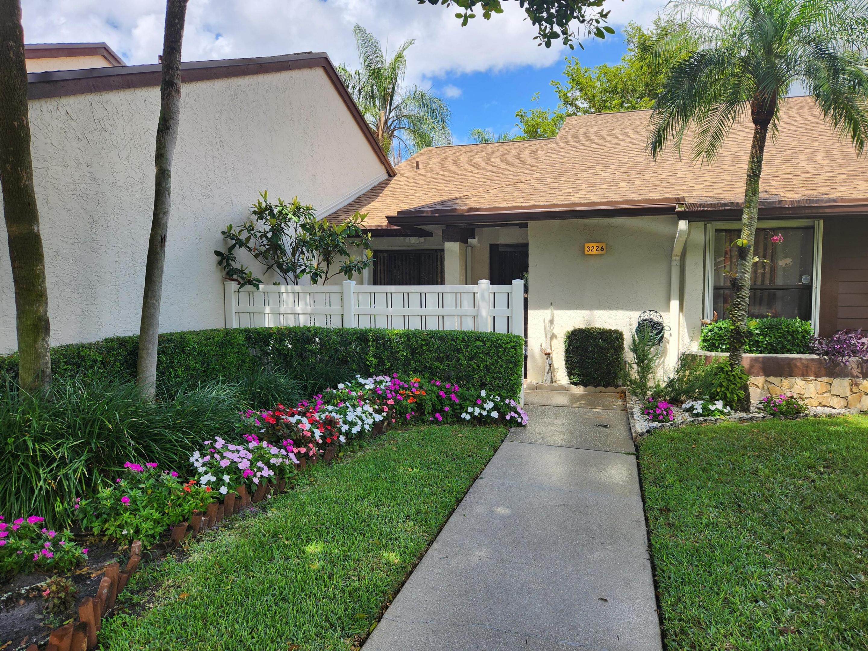 PRICE JUST REDUCED!!!  EVERYTHING IS UPGRADED. GORGEOUS WATERFRONT PANORAMIC VIEW. SECURE, QUIET COMMUNITY. COMMUNITY HAS RESORT STYLE AMENITIES INCLUDING TENNIS, GYM, LIBRARY, HOT TUBS, POOLS, PICKLEBALL, JOGGING PATH, AND MORE. BEAUTIFUL 2 BEDROOMS, 2 BATHROOMS VILLA. MOVE-IN READY ALL UPGRADED BEDROOMS, BATHROOMS, KITCHEN AND FLORIDA ROOM  DESIGN FOR COMFORT, STYLE AND FUNCTIONALITY. LARGE WALK-IN CLOSET, AND A SPLIT FLOOR PLAN FOR THE UNIT. SPECIOUS PRIMARY BEDROOM WITH DIRECT ACCESS TO FLORIDA ROOM VIA SLIDING DOOR, LIVING ROOM ALSO HAS INDEPENDENT ENTRANCE TO  FLORIDA ROOM. LARGE FLORIDA ROOM WITH  SLIDING GLASS DOOR OVERSEEING PANORAMIC VIEW OF THE LAKE AND A LOT OF GREENERY. VAULTED CEILING AND WOOD-LOOK TILE FLOOR, RECESSED LIGHTING, ACCORDION SHUTTERS AT THE FRONT AND BACK. RING DOOR BELL AT THE FRONT AND RING FLOODING LIGHT CAMERA AT THE BACK. ELECTRONIC  THERMOSTAT.  AIR CONDITIONER INSTALLED  IN 2022, WATER HEATER IN 2021. SAMSUNG  WASHER AND DRYER IN SPECIALLY EQUIPPED LAUNDRY ROOM. LUXURIOUS BATHROOM WITH BARN STYLE DOOR , BATHTUB, GLASS SHOWER DOOR, AND JET SHOWER TOWER SYSTEM WITH RAINFALL AND WATERFALL. THE SAME IN THE SECOND BATHROOM. NEW ROOF WAS INSTALLED END OF 2025. BEAUTIFUL FRONT PATIO FOR RELAXING AND ENTERTAINING. GORGEOUS BACK FOR BARBEQUINE AND ENJOYING TRANQUIL WATER VIEW. NEAR TO SHOPPING CENTERS, SCHOOLS, POST OFFICE, POLICE STATION, TURNPIKE AND I-95