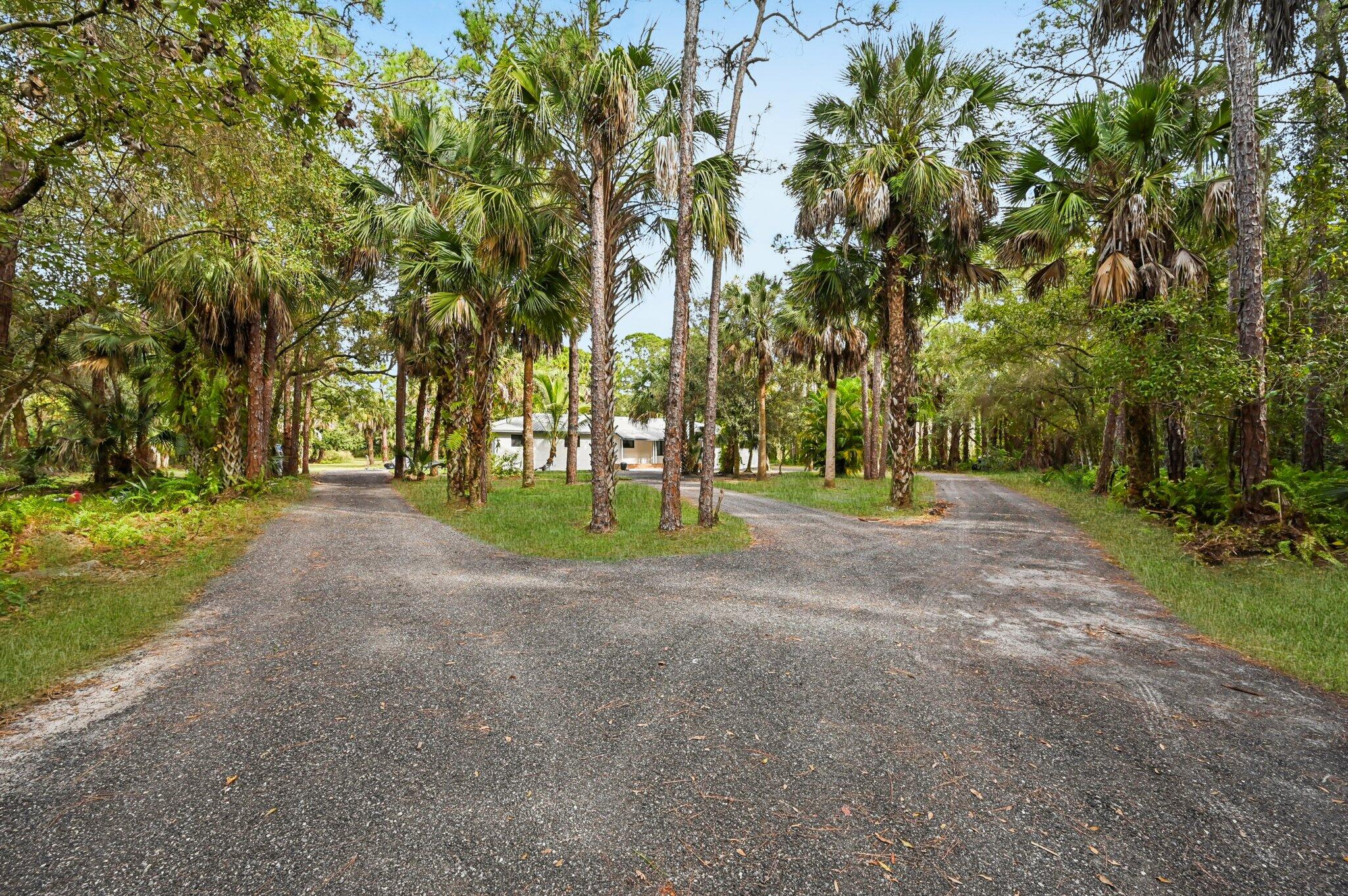 Welcome to this stunning residence nested on 10 acres of serene land, surrounded by a charming ranch community.Mature trees framed the property, offering both privacy and natural beauty. It fixtures:Spacious layout with 4 bedrooms and 4 bathrooms, thoughtfully designed for comfort and functionalityMother-in-law suite perfect for extended family or guests, providing privacy and convenience.Chef's Kitchen newly renovated with high end appliances, granite countertop and ample storage and pantry.Electric Gate and Two cars garage with electric door for ease and security. Impact windows, new AC and new roofExpansive acreage with beautiful trees ideal for relaxation, recreation or equestrian pursuit 10 Acres, agriculture zoning! This property offers the best of country living with the comfort of modern upgrades. Located in great neighborhood, close by Christ Fellowship Church, excellent rated schools.