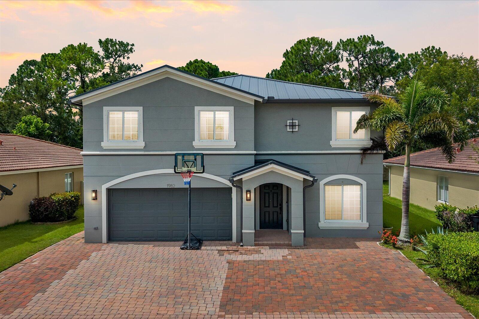 Welcome to these 5 bedrooms, 3-bathroom home, features New Metal ROOF, laminate floors and spacious bedrooms. Enjoy the large covered screened patio, perfect for gatherings. The extended driveway fits up to 7 cars. Located in a gated community close to I 95 and the tradition area for shopping and dinning. Don't miss out schedule a visit today