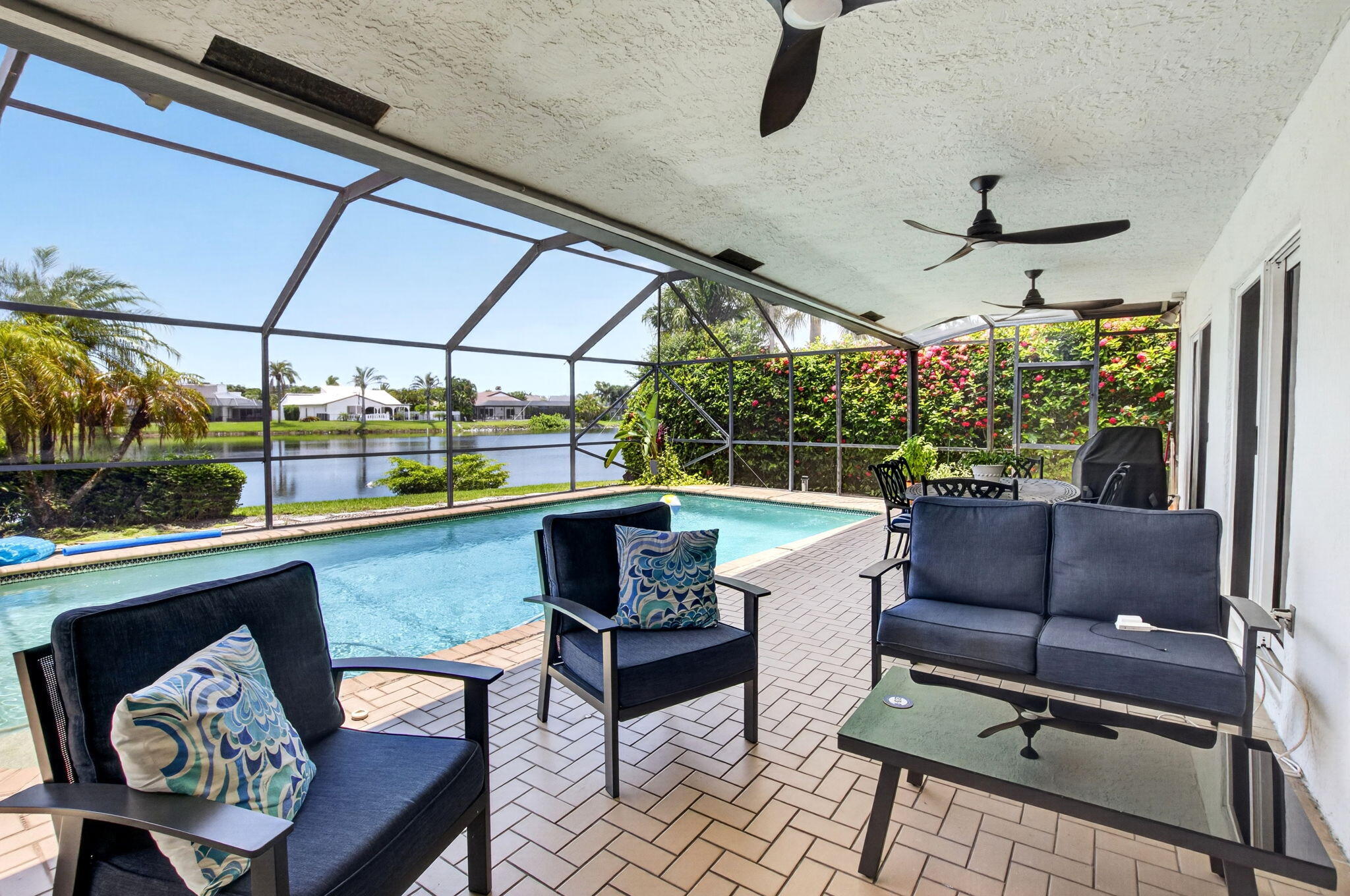 Experience the best of East Boca living in this beautifully reimagined four-bedroom, two-and-a-half-bath residence, nestled within an exclusive private gated lakefront community. Completely transformed with a top-to-bottom renovation, this home offers the perfect blend of luxury, comfort, and modern coastal elegance.  Every detail has been thoughtfully updated, including impact glass throughout, a custom-designed gourmet kitchen, a tankless water heater, and a heated private pool, creating the ideal setting for year-round Florida living. Light-filled interiors showcase sophisticated coastal-inspired finishes and exceptional craftsmanship at every turn.  Located in a highly sought-after school district, this exceptional home is just minutes from I-95 and less than two miles from Beaches