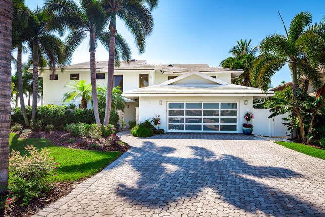 Updated, SE rear exposure, 119' of waterfront on 9,531 sq. ft. lot  with intersecting views of both the wide, deep  canal and the Intracoastal Waterway.  Beautiful views with an abundance of natural light from floor-to-ceiling and wrap around windows. Ideally situated one lot off of the Intracoastal and located in the highly sought after Yachting community of Tropic Isle. Boasting 4 bedrooms, 3 full and two half baths, Hurricane impact windows, full house generator and a 4 season back yard made for entertaining, this is South Florida lifestyle at its finest! 
Dock 51' Waterfront 119'
Dock 51'
HVAC 2013
Downstairs compressor replaced 2019
Upstairs Compressor replaced 2020
roof replaced 2019
pool diamondbrite completed Feb. 2023