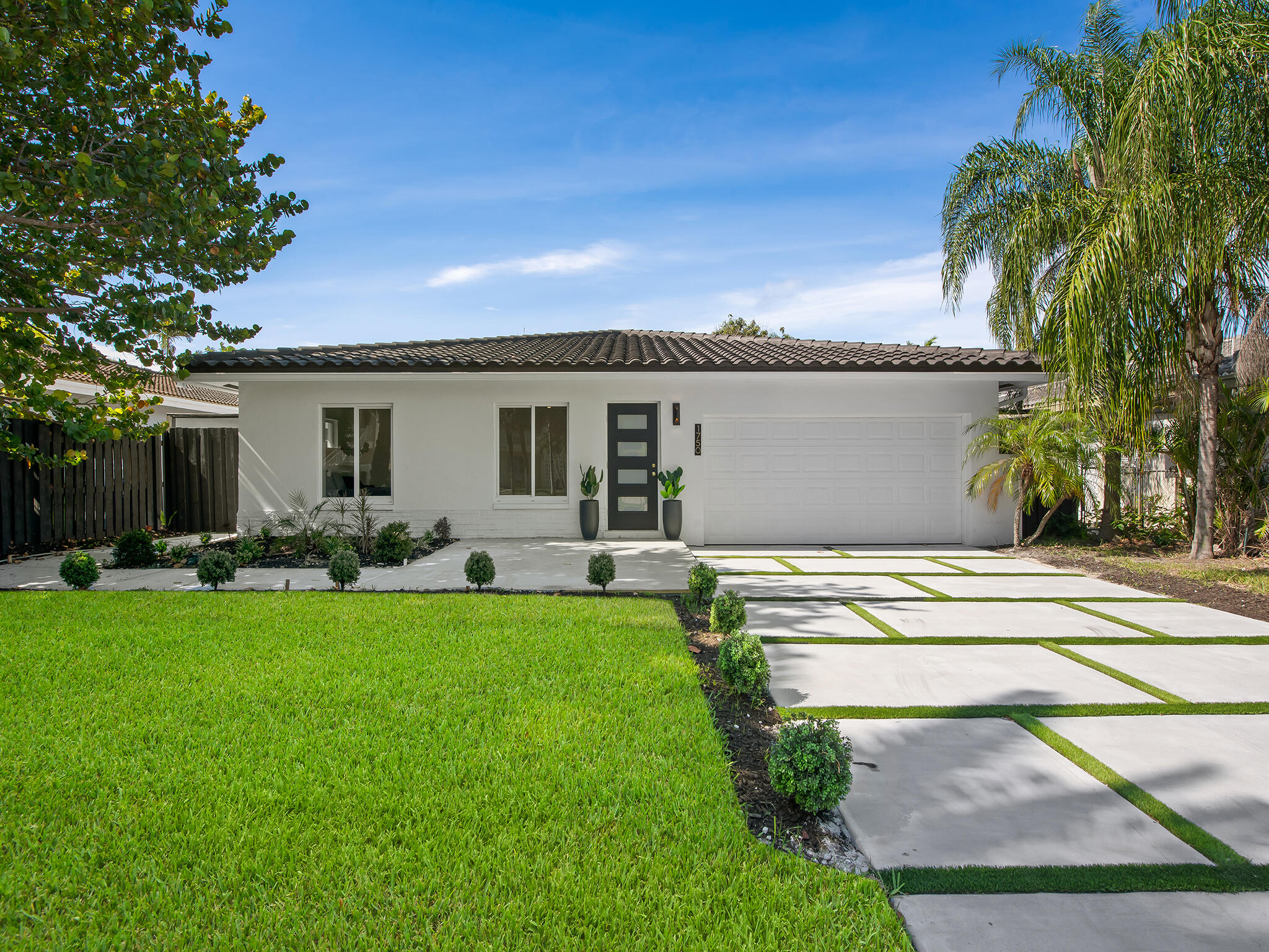 Fully renovated 3/3 pool home in sought-after Coral Ridge Isles, blending modern design with exceptional upgrades. Spanning nearly 1,900 square feet, this move-in-ready residences upgrades include impact windows and doors, roof, HVAC, plumbing, electrical, driveway, and tropical landscaping. Inside, large-format porcelain tile flows throughout, while the stylish kitchen showcases polished granite countertops, stainless-steel appliances, and a spacious island perfect for entertaining. Spa-inspired bathrooms offer elegant escape. Outdoors, enjoy a refinished pool, expansive patio, and fully fenced private yard. Ideally located minutes from beaches, dining, and shopping, this turnkey property is perfect as a primary residence, vacation home, or income-producing investment.