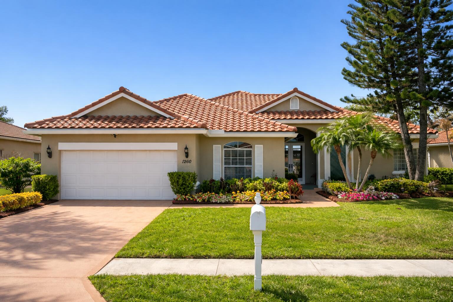 Stunning lakefront residence in the gated community of Heatherwood, offering one of the largest floor plans in the neighborhood. This 4-bedroom, 3-bath home features a versatile in-law suite with private entrance, full bath, and access to an outdoor kitchen—ideal for multi-generational living or guest accommodations. The home includes two separate laundry areas, with one dedicated to the main residence and a second serving the in-law suite, providing added convenience and privacy. The open layout with vaulted ceilings creates a bright and spacious feel, complemented by a well-appointed kitchen with granite countertops and tile flooring. Enjoy long, tranquil lake views throughout the home. Recent updates include a newer roof (approximately 1 year old).  A rare opportunity to own a spacious waterfront home in a desirable gated community.