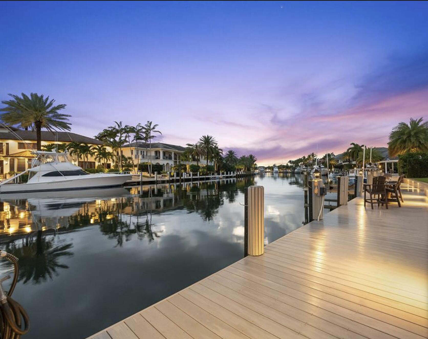 Welcome to one of Lighthouse Point's finest deepwater estates, perfectly situated on a quiet, prestigious street in the highly desirable Lake Placid neighborhood. Set on an oversized lot with 95 feet of waterfrontage and approximately 85 feet of dockage, this property offers wide water views, no fixed bridges, and direct ocean access, making it a dream for boating enthusiasts. From the moment you arrive, you'll appreciate the quiet surroundings and welcoming atmosphere that make this home truly special. Inside, expansive living spaces are bathed in natural light and thoughtfully designed to capture beautiful water views while seamlessly connecting indoor and outdoor living.  The single-story floor plan features generous gathering spaces, a private office, and beautifully appointed bedrooms, creating an ideal balance of comfort, warmth and functionality. Step outside and discover your own private waterfront retreat. Enjoy refreshing breezes, a resort-style pool, and multiple outdoor spaces designed for relaxing, entertaining, and taking in the tranquil water views. Positioned on one of Lake Placid's widest deepwater canals, the property offers exceptional dockage and effortless access to the Intracoastal waterway and Atlantic Ocean. Meticulously maintained and move-in ready, this home embodies the relaxed elegance that defines South Florida living. Whether hosting family and friends, enjoying a quiet morning by the water, or setting off for a day on the boat, every detail has been designed to embrace the waterfront lifestyle. A rare opportunity to own a peaceful deepwater sanctuary in one of South Florida's most sought-after boating communities.