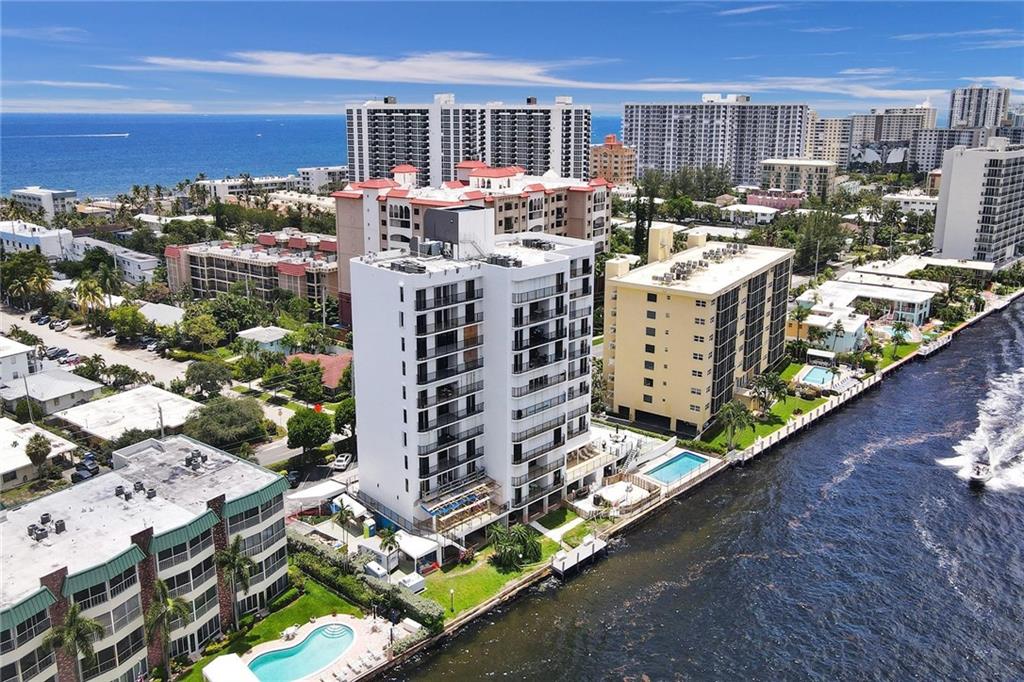ENORMOUS PRICE ADJUSTMENT. Current owner purchased this unique condo from the builder 23 years ago. The builder opted to build out 2 units and make them into one very large unit for his own use.  All the living areas including the bedrooms face the Intracoastal with endless ICW views along the entire condo. Sliders in the living area lead out to the expansive custom covered terrace with private stairs from your terrace leading right down to the beautiful pool area. There are two assigned covered parking spots and additional guest parking. THE UNDERMARKET PRICE REFLECTS OWNERS DESIRE TO HAVE THE CONDO SOLD. Given the location and condition it is unlikely you will find a price like this with 3000 square feet directly on the ICW one block from ocean anytime in the coming future.