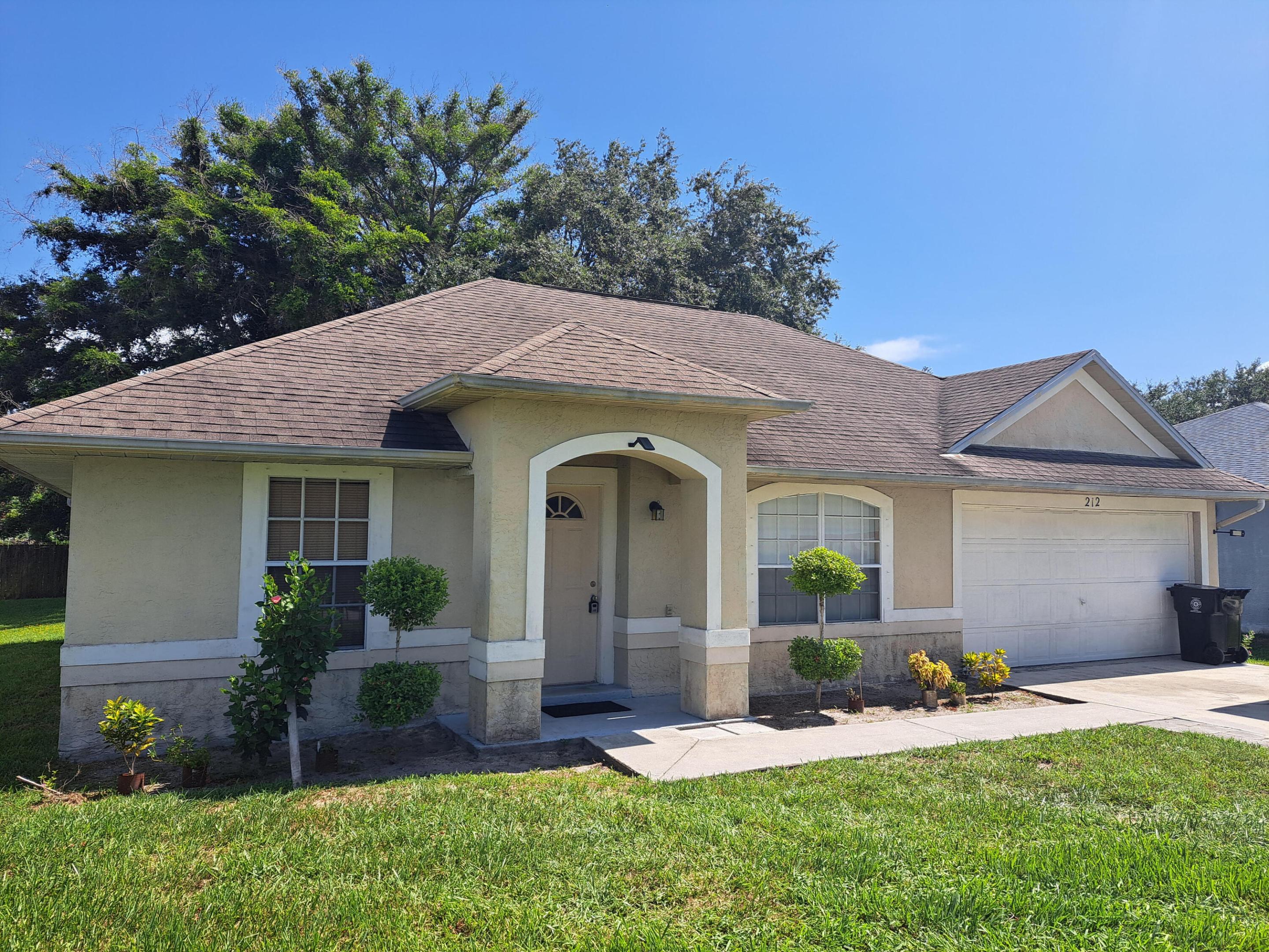 Welcome to this charming single-story residence located in Port St. Lucie Section. This three-bedroom, two-bathroom home offers 1,184 square feet of finished living space, providing comfortable accommodations for modern living. The property features a two-car garage for convenient vehicle storage and parking. Situated in the established Port St. Lucie community, this residence presents a practical option for those seeking a straightforward, well-proportioned home. The roof on this home is older which is reflected in the price, but this home is a great value for a 3-2 under 300k.