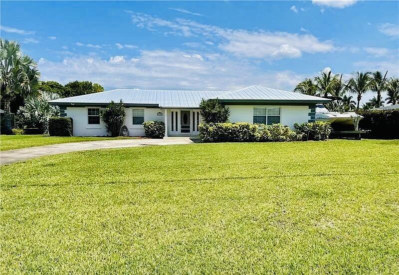 Welcome to this charming 4-bedroom, 2-bathroom single-story residence in River Park-Unit 4, Port St. Lucie. Spanning 1,392 square feet of finished living space, this home offers comfortable proportions and functional layout across one convenient floor. The waterfront property location provides a distinctive setting with direct water access. A single-car garage provides convenient parking and storage. This well-appointed residence presents an excellent opportunity for those seeking a practical home with waterfront appeal in an established community.