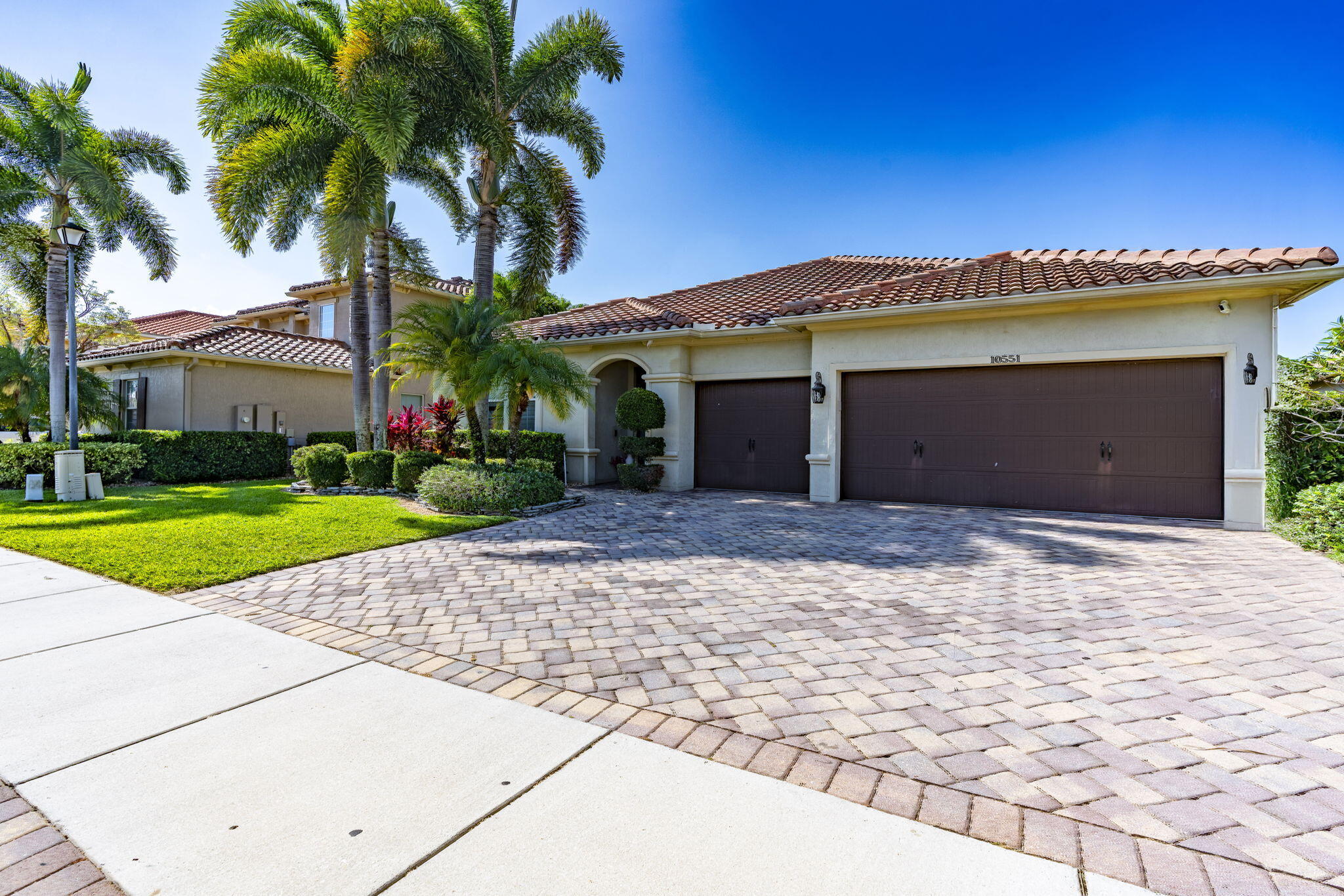 Beautiful 4-bedroom, 3.5-bath waterfront pool home with a den and 3-car garage in the gated community of Oakmont Estates. Fresh interior paint, 2010 roof, 2019 A/C air handler, and 2023 water heater. Enjoy one of the best lake views in the community from your private pool and backyard oasis. HOA is $450/month and includes cable plus resort-style amenities including a clubhouse, fitness center, community pool, tennis, pickleball, basketball, and playground. Zoned for Panther Run Elementary School, Polo Park Middle School, and Wellington High School. Conveniently located near shopping, dining, and Wellington's world-renowned equestrian venues.