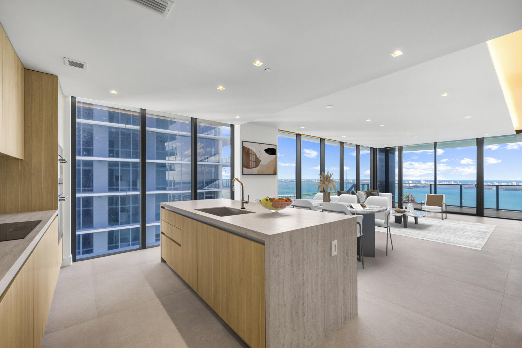 Stunning, never-lived-in new construction. Arrive by elevator into an exclusive entry foyer and step into a light-filled corner home with unobstructed views of Biscayne Bay, the Miami skyline, and the ocean. East-to-west exposure delivers breathtaking sunrises and sunsets. Features include an upgraded kitchen, new designer lighting package, 24x48 porcelain tile flooring, built-out closets, and motorized shades throughout. The layout includes a versatile den and an additional private entry. Enjoy 10-ft floor-to-ceiling windows and an extraordinary 291-ft terrace overlooking the water. Aria Reserve amenities offer a resort-style pool, spa, cabanas, courts, and lush landscaped grounds. Move-in ready waterfront luxury.