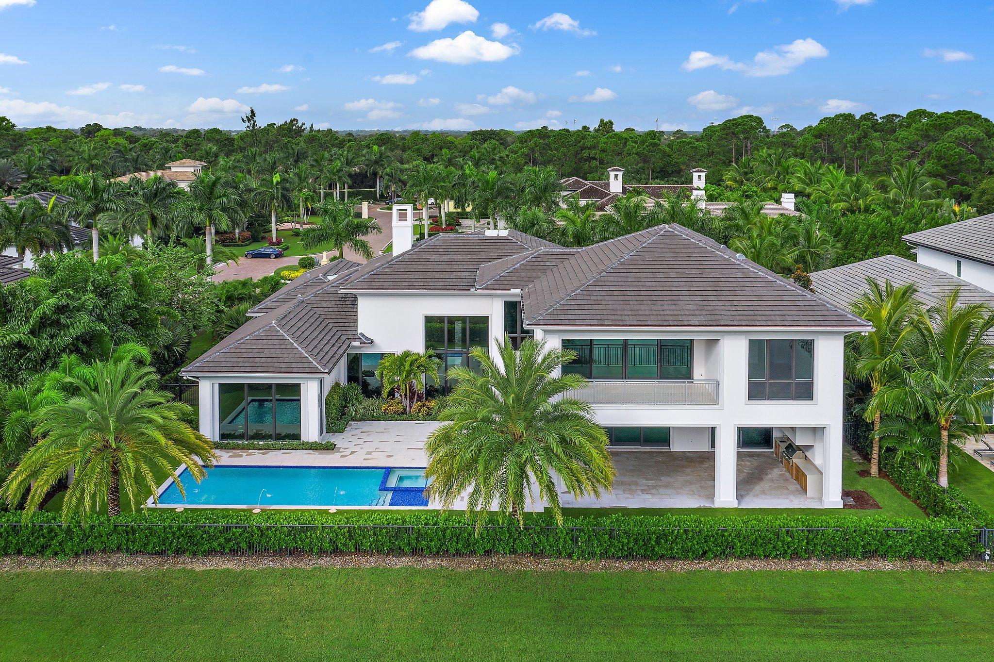 Stunning one of a kind contemporary, custom model home with a spectacular view of the pond and golf course. The interior furnishings are being completed by noted designer, Terri Polimeni by mid December. This newly construction home offers volume ceilings and European features though out. Beautiful marble & European white oak floors. Light, bright open floor plan w/custom glass wine display between living and dining rooms. Expansive owners suite, his/her bathrooms and more than ample closet space. White gloss kitchen cabinets w/quartz counter tops. Top of the line European Gaggenau wall ovens & Miele appliances. Laundry has 2 washer/dryers. Spacious guest suites and loft upstairs w/covered balcony captures the east breezes. This new construction home will be ready just in time for season!