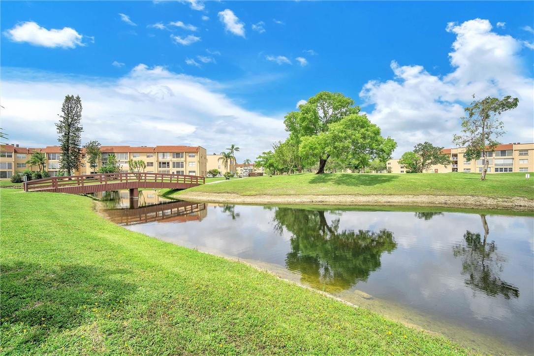 MUST SEE!!! BEAUTIFUL 2B/2B CONDO IN A WELL MAINTAINED AND QUITE 55+ SUNRISE LAKES COMMUNITY. THIS CONDO IS LOCATED ON THE 2ND FLOOR WITH A LARGE SCREENED IN BALCONY WITH A PANORAMIC VIEW THAT OVERLOOKS CALMING WATER AND A GOLF COURSE. BOTH BEDROOMS ARE SPACIOUS W/WALK-IN CLOSET WITH WATERPROOF LAMINTED FLOOR AND A EN SUITE BATHROOM. KITCHEN IS BRAND NEW WITH QUARTZ COUNTER-TOPS AND STAINLESS STEEL APPLICANCES. MOBILE SECURITY PATROL 24/7, WHILE ENJOYING THE AMENITIES SUCH AS, POOL, TENNIS COURTS, GAZEBO, SHUFFLE BOARD, GYM AND GOLF COURSE. MAINTENANCE FEE INCLUDES FREE GOLF MEMBERSHIP, CABLE, BUILDING INSURANCE, WATER, TRASH, PROPERTY MAINTENANCE AND SECURITY. EASY TO SHOW