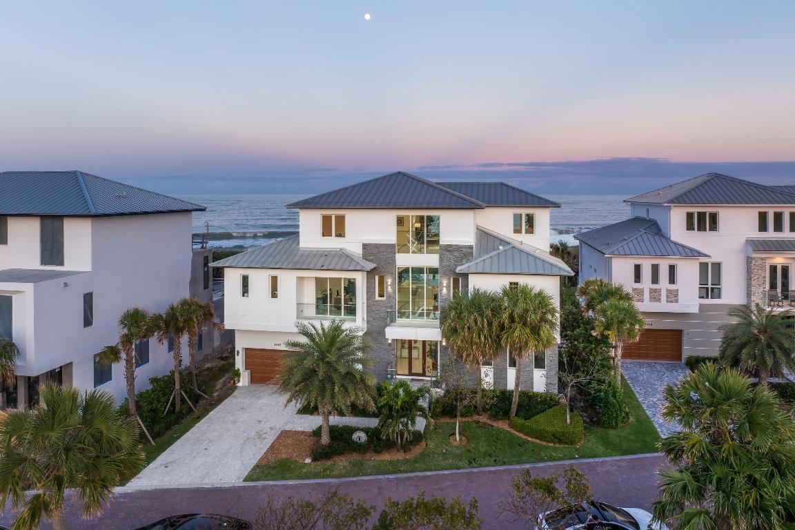Indulge in coastal luxury with this newly built in 2022, over 10,250 tot sq', oceanfront retreat in the Aquavista community of North Hutchinson Island. Enjoy unparalleled privacy on a centrally located private road, shielded from neighboring condos and community entrance traffic. Revel in panoramic views from multiple terraces and patios offering both sunrise and sunset vistas. The residence features 48'' porcelain tile, white oak stair treads, and glass stair rails throughout. Take a dip in the infinity-edge private saltwater pool/spa—all while embracing the tranquil charm of the Atlantic Ocean. This 5-bedroom, 7-bathroom haven boasts garage parking for 6+ vehicles & all your toys. Experience culinary excellence in the gourmet kitchen featuring top-of-the-line Thermador and Bosch appliances. This Oceanfront oasis elevates every moment with 10-foot window heights in all formal areas, providing breathtaking views, complemented by 10-foot sliding glass doors that seamlessly blend indoor and outdoor living. Completely finished expansive 700+ sq ft guest retreat, a sanctuary within itself. This private space features a private entrance, full bathroom for convenience and two spacious walk-in closets, providing ample storage. Your guests will relish in comfort and luxury, ensuring a memorable stay in this oceanfront residence. This oceanfront abode goes beyond expectations, offering a dedicated office space with a full bathroom for utmost convenience. The property also features an open loft on the 3rd floor, perfect for a workout area or versatile use. Adding to the ease of living, an elevator ensures seamless access to all levels, combining functionality with the utmost sophistication. This coastal haven, designed by Randall Stofft, offers a perfect fusion of luxury, functionality, and panoramic beauty!!