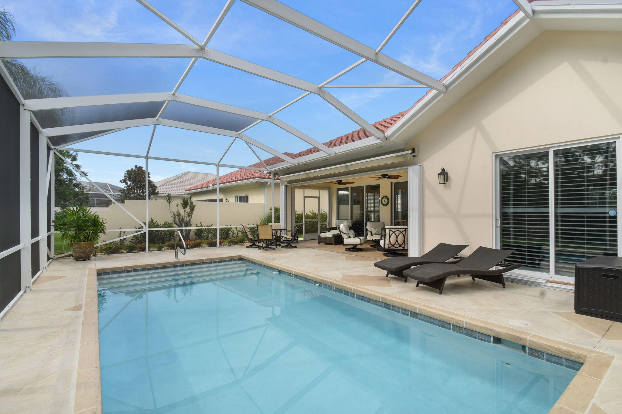 Extraordinary 3/2.5 plus extra office in most desired community in Hobe Sound. Everything completed! New roof & gutters 2024, resurfaced heated pool and deck 2024, A/C & W/H 2022, kitchen cabinets and stacked wall in living area 2025, interior plantation shutters, quartz counter tops, built in storage pantry, entire home water purifier,  accordion storm shutters, new garage door spring and drums, retractable awning over lanai, and more! View deer right outside your screened patio. Community boasts heated pool, fitness room, club house, tennis, Women's club and Bocce. Golf and boating available nearby. Low HOA. Furniture negotiable.  Comes with never used generator.