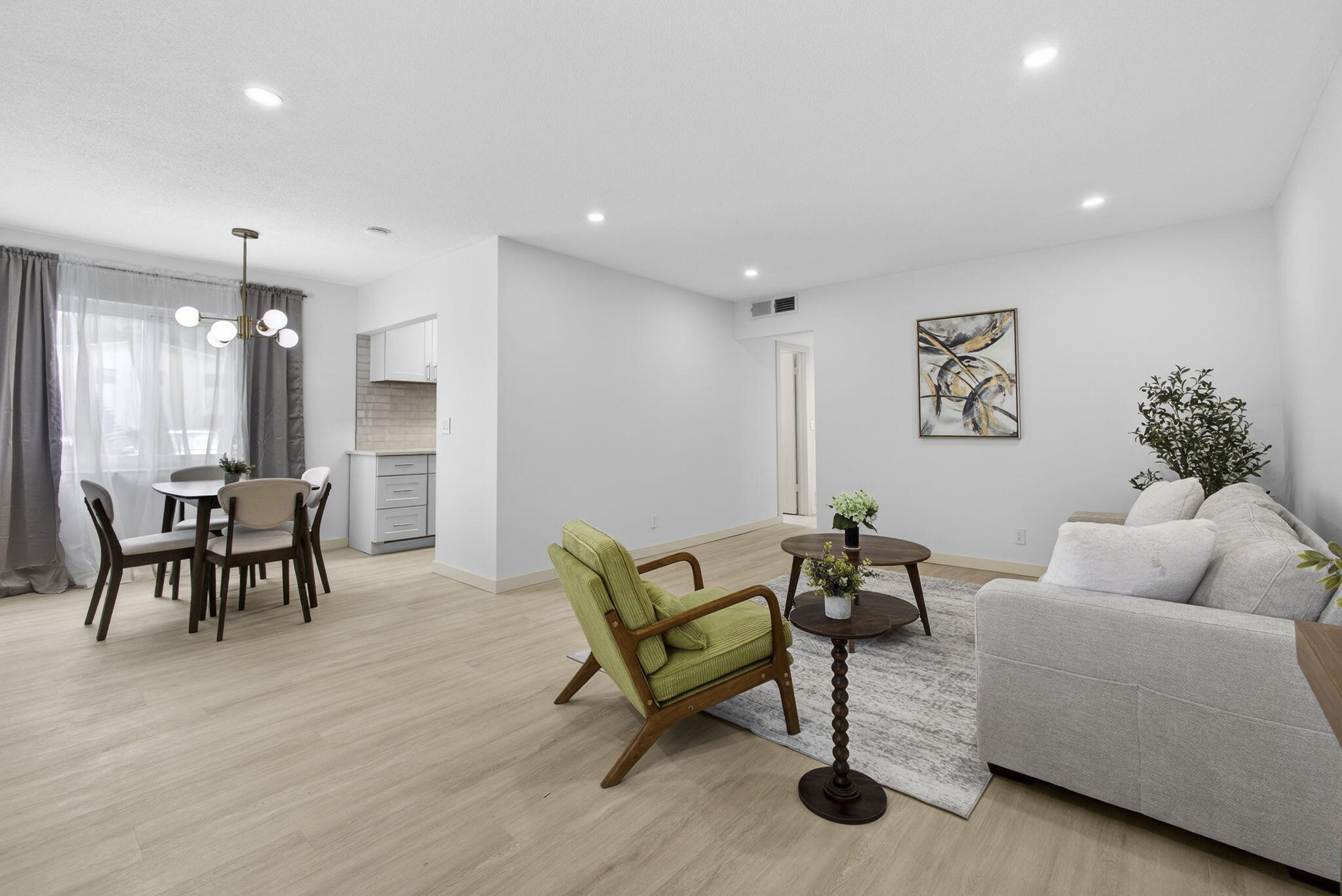 Stunning fully renovated corner-unit condo in a premier 55+ community. This light-filled 2-bedroom, 2-bath residence offers a sophisticated open floor plan with elegant wood-grain plank laminate flooring throughout. All windows and doors are impact, providing peace of mind and energy efficiency. The updated kitchen features brand-new stainless steel appliances, new cabinetry, and quartz countertops. Bathrooms are beautifully renovated with designer tile, modern vanities, and stylish lighting. Additional upgrades include a brand-new A/C unit (2025). Residents enjoy resort-style amenities including clubhouse, fitness center, pool, walking paths, bus service, and an active social calendar. Can be sold fully or partially furnished with all-new, never-used furniture. SELLER FINANCING!