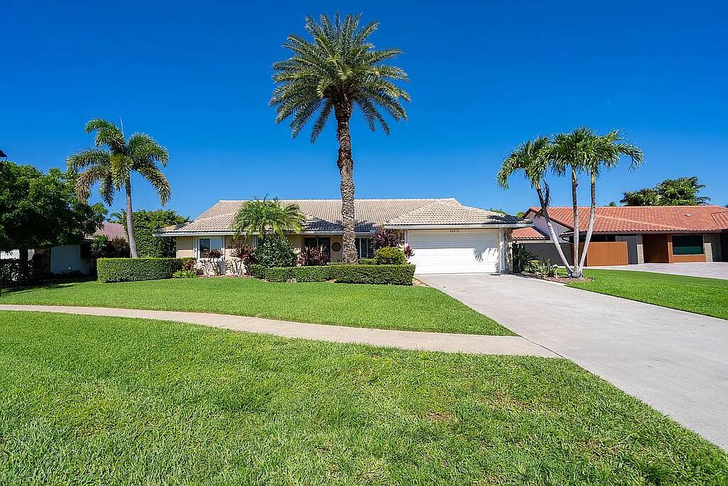 Welcome to 22373 Ensenada Way a spacious and beautifully maintained four bedroom two bath single-family residence located in the desirable estates of Boca Lyons community of Boca Raton. Situated on an oversized lot of nearly a quarter of an acre this home offers over 2160 ft.² of comfortable living space under air with a functional four bedroom plan, ideal for families and entertaining alike. Built in 1986 the home feature is bright open, living areas, generous size rooms and a large backyard showcasing a beautiful oversized heated pool and working outdoor bar making this a true tropical retreat. The Home is fully protected by hurricane windows and doors and also offers a well for the underground sprinkler system. Located in a quiet residential neighborhood with top rated schools. This home offer parks, shopping and dining with easy access to major highways. This Gem combines privacy, convenience, and value within one of Boca Raton's most sought off neighborhoods. A rate opportunity!