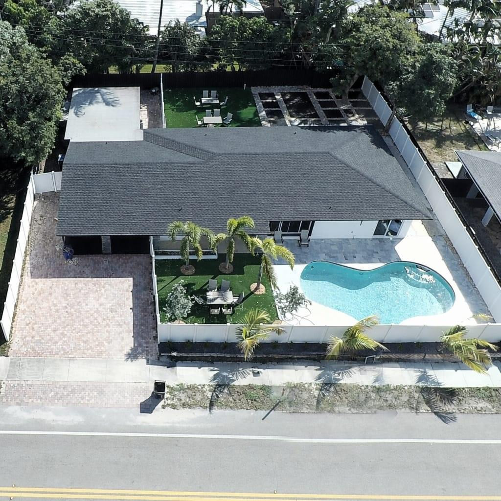 A tropical oasis located in the heart of the Middle River community is a truly unique opportunity to own in the highly desirable Coral Ridge neighborhood. Located only 1 miles away from the ocean and in the heart of it all! This duplex (with 2 freestanding properties, 4/3 main-house and 2/2 side-unit) has been perfected with each and every detail. From newly installed oversized porcelain floors, custom soft-close cabinets, custom quartz countertops and backsplash, ss appliances, to the brand newer roof. Completely redesigned front and backyard will allow you to relax by the refinished pool surrounded by tumbled marble pavers and artificial grass. Don't let your buyer miss this! Please just do not Disturbed tenants properties occupied HIGH DEMAND FOR STR