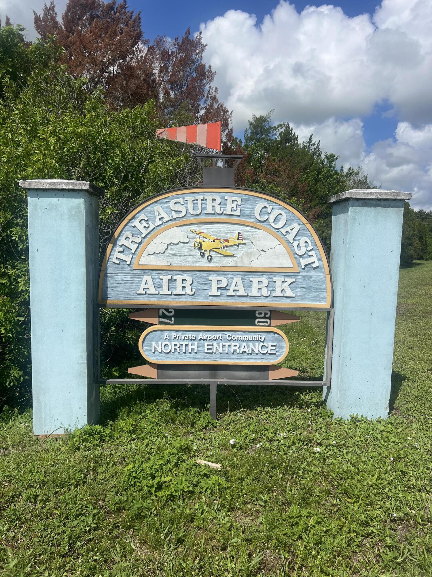 SPACE !! In a city that is closing in on every available buildable parcel, you can have 2.28  acres, plus a 40 x 50 airplane hanger, with a Schweiss hydraulic door, to store your things for business or pleasure. If you have a small plane, bring it ! The airpark has one of the finest private runways in Florida, over 4000 feet with lights.  The 3 bed, 2 bath pool home connected to fully paid for solar system reducing energy costs year round.  The home  has a water treatment system as well as an under counter osmosis system in the kitchen. Ck Docs sect., HOA includes the cost of a note on the runway upgrades for approx. 12 more years. Complete aeronautical information about Treasure Coast Airpark search Airport FL37,  All room meas. approx.  Professional photos coming soon.  Florida Broad Ban leases space to attach an antenna on the hanger for cable free television and provides a small revenue. Home is cable ready for other services if desired.