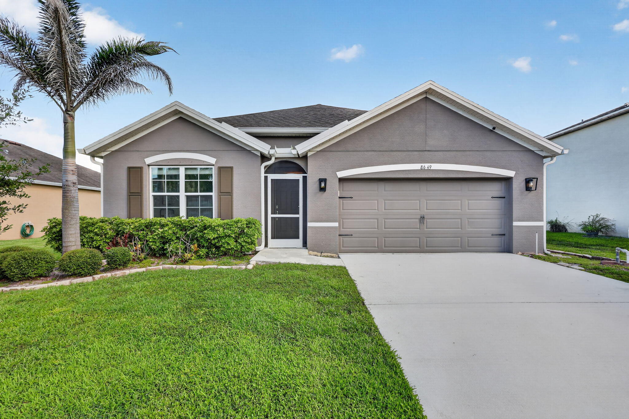 Located in one of Ft. Pierce's most sought-after communities, this stunning Extended Cali model offers modern living with peaceful waterfront views. Designed as a smart home for today's lifestyle, you can conveniently control the door locks, lighting, thermostat, and lawn irrigation system from your phone.  The spacious open-concept floor plan is perfect for entertaining or accommodating a growing family. The upgraded kitchen features modern fixtures, a stylish sink, and a generous walk-in pantry with extensive storage. The separate laundry room includes a full-size washer and dryer for added convenience.  Additional upgrades include enhanced lighting throughout the home and a RainSoft whole-home water filtration and softening system. Both the front entry and rear porch are screened, providing a comfortable outdoor living space year-round.  Step outside to view the tranquil lake and abundant wildlife from your backyard—the perfect setting for morning coffee or relaxing evenings.  The community is nearing completion of its impressive new amenities, including a swimming pool and clubhouse, adding even more value and enjoyment to this desirable neighborhood.  Conveniently located just minutes from I-95 and the Florida Turnpike, with easy access to shopping, dining, and everyday essentials, this home offers the perfect blend of modern technology, comfort, convenience, and natural beauty.  Don't miss your opportunity to own this exceptional waterfront home in one of Ft. Pierce's premier communities!