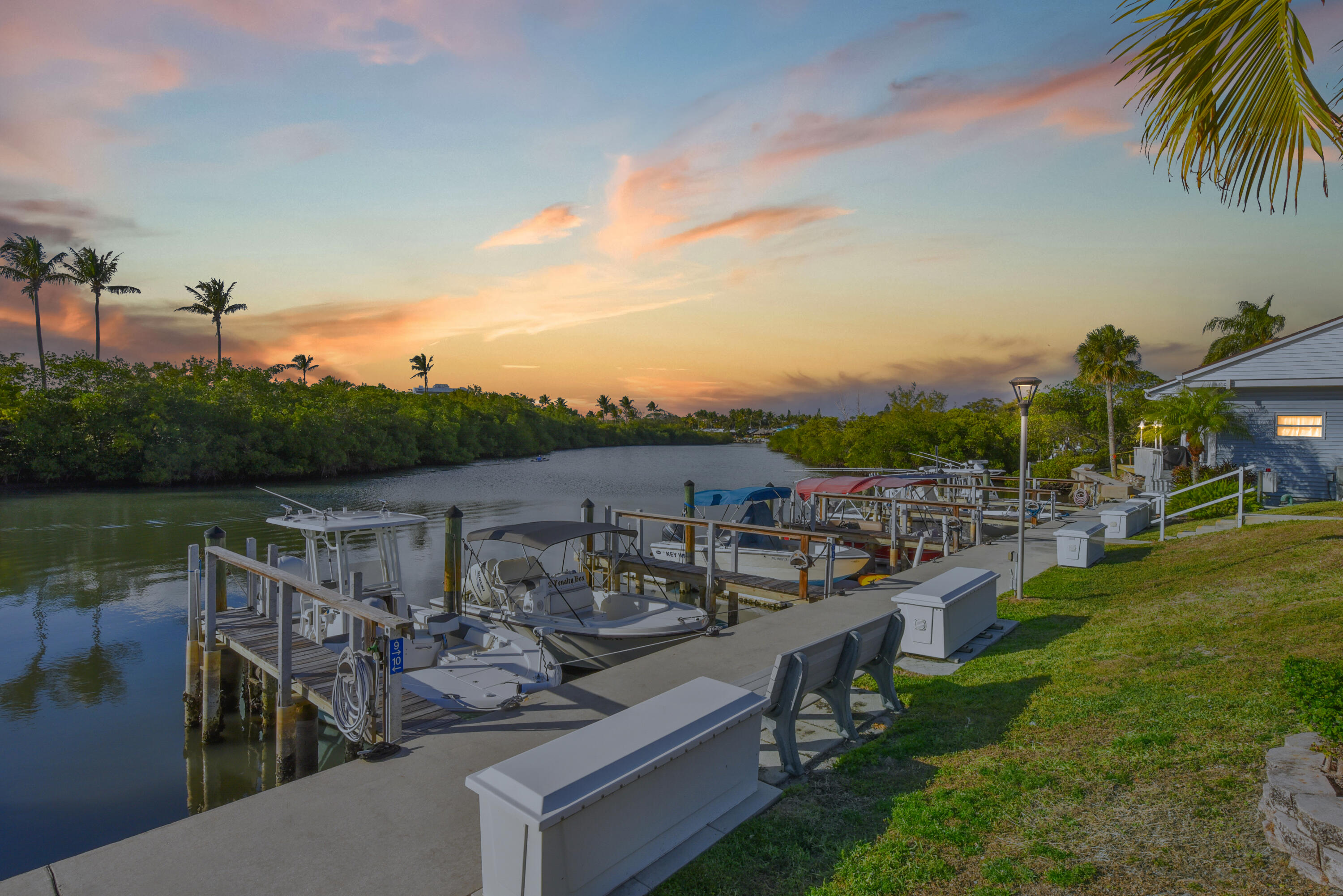 Discover the charming coastal living of Jupiter River Park, YOU OWN YOUR LOT, OWNER FIANANCING!! Home #65 is turn-key Move-in ready! to this 2 bedrooms, 2-bathw den Jacobsen model  with a spacious kitchen w/updated appliance, Wall oven, a separate laundry room, screened front porch, storage shed, and carport. The master suite includes a den or sleeping area with French doors, a master bath with dual vanity, jetted spa, separate shower, a large walk-in closet. Tile and laminate flooring throughout. This vibrant 55+ community on the water with Boat slips to rent, Easy walk to Guanabanas, Par 3 golf, Maltz Theatre, pickleball courts, Carlin Park, Jupiter Inlet pier for fishing.  Owner is a Licensed Realtor