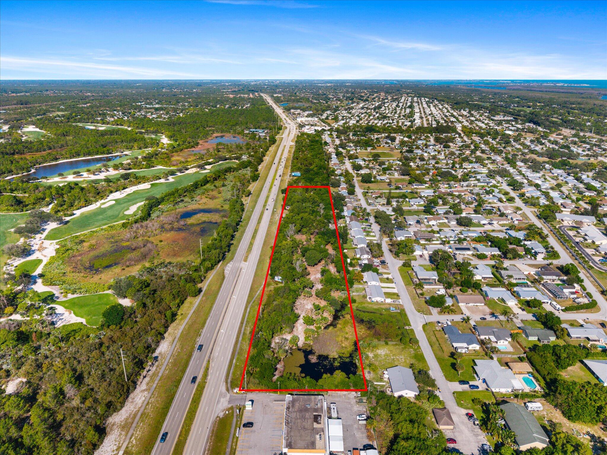 Discover endless opportunities with this expansive 6.05 acre land parcel, strategically located off of US-1 and directly across from the prestigious Medalist Golf Club. Zoned for commercial, residential, or office space, this property caters to a wide range of development possibilities. Just a short drive, less than 10 minutes, takes you to beautiful beaches, ideal for those seeking the perfect blend of business and leisure.  Whether you're envisioning a luxurious residential estate, a thriving commercial hub, or a modern office complex, this prime location offers the visibility and accessibility to make your project a success. Enjoy the benefits of being near major roadways and popular amenities, ensuring convenience for future residents, clients, or customers. Don't miss out on this rare opportunity to own a substantial piece of land in a sought-after area with close proximity to world-class golf and stunning beaches. Make your vision a reality on this exceptional property.