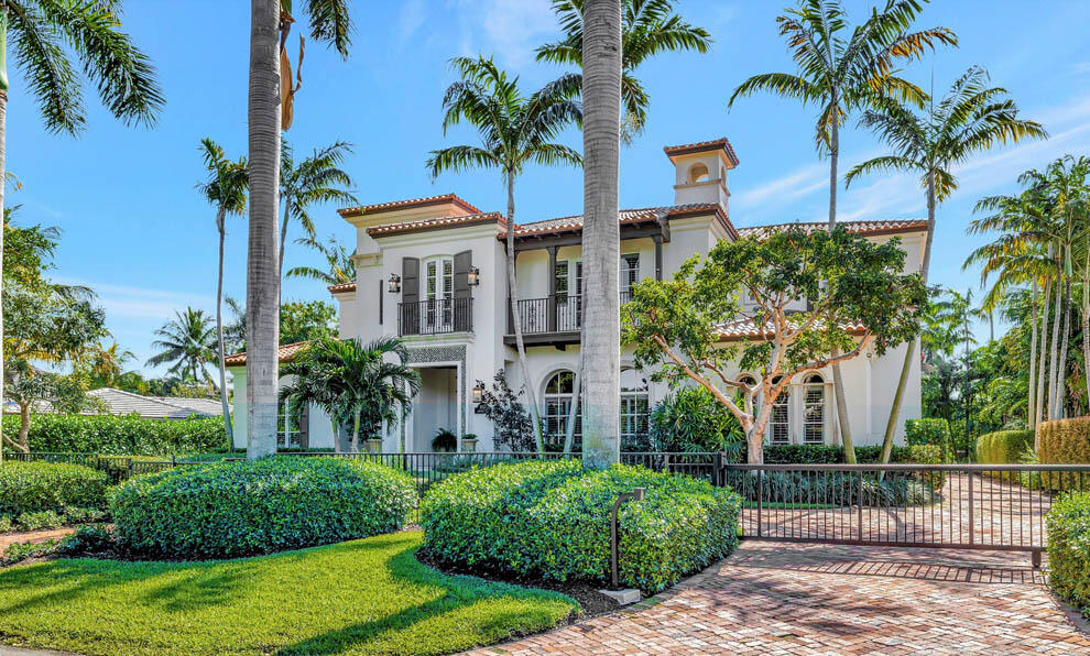 This East Delray Beach compound in the Seagate neighborhood is ideally located just blocks from the beach and Atlantic Avenue. Designed by Randall Stofft and completely updated in 2015, the property offers high-end finishes and designer touches. Boasting over 8,700 total square feet, the home has six bedrooms with guest house; formal foyer and living areas; office; and gourmet kitchen that opens to the family room, outdoor dining area, and pool. The private and gated grounds feature decorative driveway; covered loggia; summer kitchen; expansive balconies; and inviting pool with spa and open terraces. Other features include three garage, two-sided fireplace, wine closet, outdoor shower, and impact glass windows and doors. This stunning residence embodies the South Florida luxury lifestyle. FEATURES:
*Located a few short blocks to beach and Atlantic Ave
*Main residence and one-bedroom, one bath guest house
*6 total bedrooms plus office / 6.2 total baths
*6,318 living square feet / 8,757 total square feet
*Designed by renowned local architect, Randall Stofft
*Completely updated in 2015 to the highest standards
*Expansive parcel with 100 feet of frontage and approximately 150 feet of depth
*Private compound with entry gate access
*Decorative driveway, walkways and front porch
*Formal foyer entry with marble floors and grand split-level stairway
*Formal living room with two-sided fireplace shared by formal dining room with wine closet 
*Gourmet kitchen with top-of-the-line stainless steel appliances; Calacatta marble triple-edged countertops; two islands with snack bar seating; casual dining area; and preparation pantry
*Family room open to kitchen with French door access to covered loggia and pool
*First floor office and guest bedroom
*Private primary suite with vaulted ceilings; wood floors; morning bar; walk-in closet; and spacious bath with glass shower, tub, and dual vanities 
*Expansive balcony that connects main house to guest house which offers private quarters with one bedroom and one bath and separate stairway entry from side grounds
*Three additional guest bedrooms on second floor
*Sensational grounds with lush landscape and abundant privacy
*Covered loggia with ample room for outdoor living and dining area
*Summer kitchen with grill and bar seating area
*Resort-style pool with spa, outdoor shower, and expansive open terrace for lounging
*Two laundry rooms
*Three car garage
*Impact glass windows and doors

Impeccably maintained, this beach area residence is the quintessential luxury home for enjoying all that East Delray Beach has to offer.