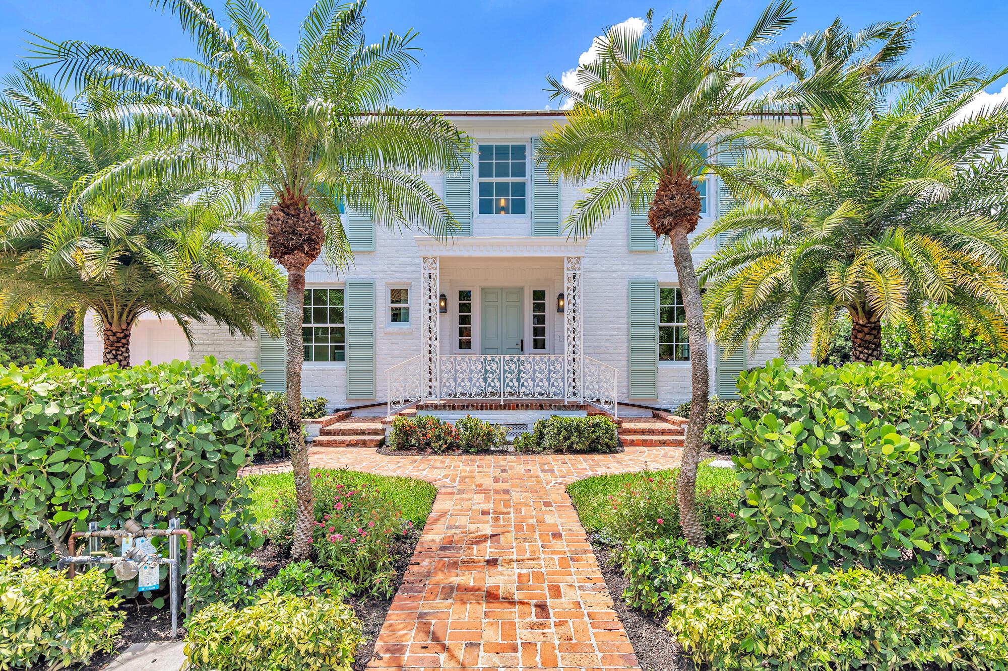Located on a desirable in-town street, this 4,500-square-foot Palm Beach Island residence was originally designed by Gustav Maas and reimagined by Smith Kellogg Architecture with interiors by Carolyn Roy of CR Studio.
Upon entering, the foyer opens to a formal living room with a fireplace, which flows into a bright sunroom overlooking the backyard. Adjacent is a dining room with a bay window that frames views of the pool and landscaped grounds.
The kitchen is equipped with top-of-the-line appliances, including a full-size Sub-Zero refrigerator and freezer, gas range, and custom range hood, and pendant lighting reclaimed from the Netherlands. A walk-in butler's pantry with a wine refrigerator and additional storage sits directly behind. A door leads from the kitchen to the backyard for easy access to the built-in grill/summer kitchen for easy outdoor entertaining.
A guest suite is privately situated off the two-car garage, ideal for visitors.
Upstairs, a large sitting room with walls of windows offers expansive views of the backyard and pool. All bedrooms feature vaulted, beamed ceilings, en-suite baths, and ample closets.
Throughout the home, high ceilings create a light and airy atmosphere. Custom details include European White Oak flooring, hand-selected Tuscan marble, and solid brass plumbing fixtures with a nickel finish.
The property is ideally located in close proximity to the Lake Trail, the ocean, The Breakers, and in town restaurants and shopping.
