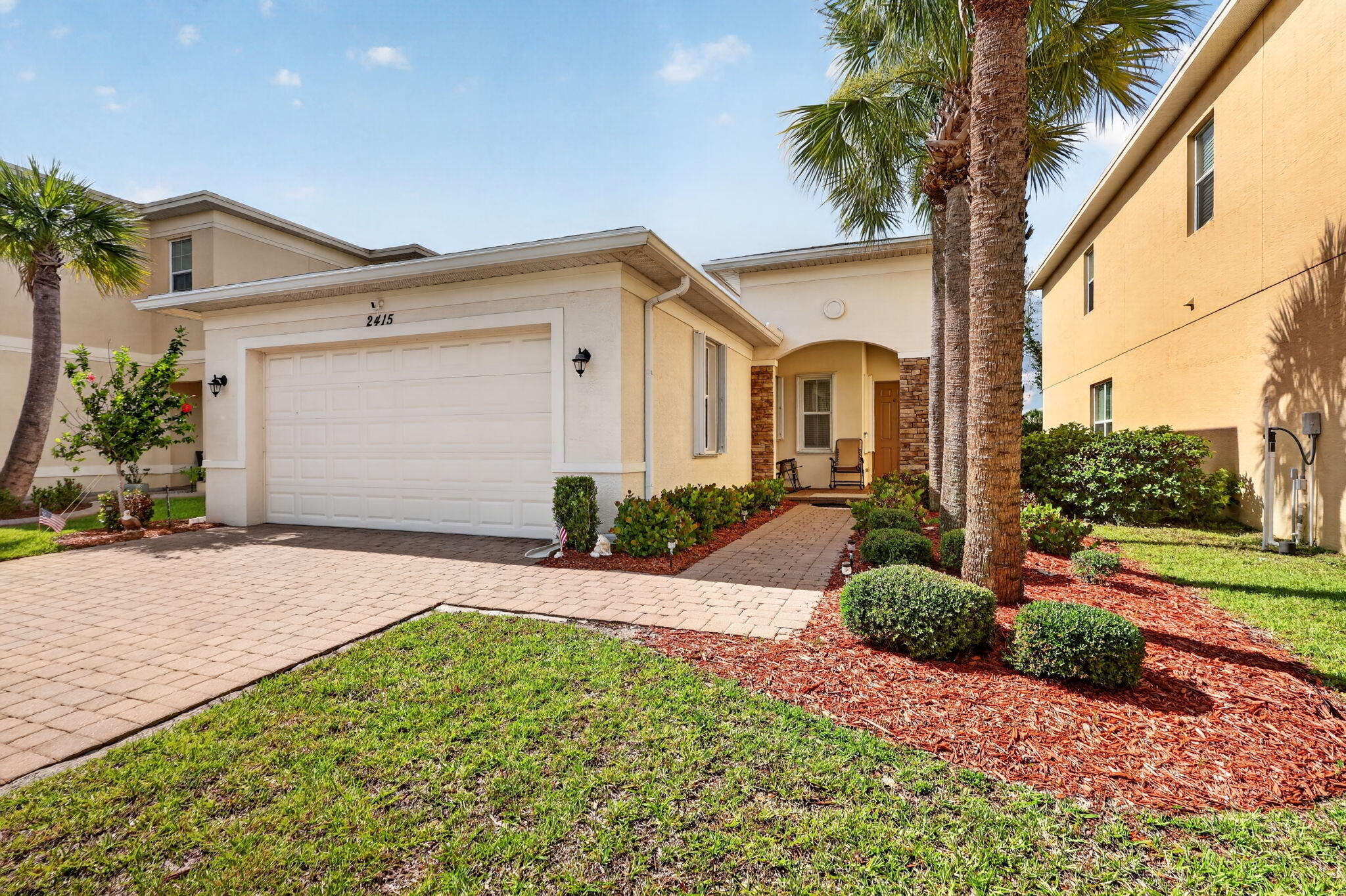 Discover comfortable Florida living in this beautifully maintained 2-bedroom, 2-bathroom home with a den and 2-car garage, ideally situated in a desirable gated community with over 1,600 living square feet built by Koltar Homes. Designed with both style and functionality in mind, this home features a spacious living and dining room combination accented by recessed lighting and easy-to-maintain tile flooring throughout the main living areas. The open-concept kitchen is perfect for entertaining and everyday living, offering stone countertops, modern cabinetry, and seamless views of the living space. Double sliding glass doors lead to a screened patio overlooking a private preserve, providing a peaceful setting with no rear neighbors. The primary suite is filled with natural light from three windows and features two walk-in closets along with an en-suite bathroom complete with a spacious walk-in shower and private commode area. Both bedrooms feature vinyl flooring and ceiling fans for added comfort. A versatile den provides the perfect space for a home office, hobby room, or guest accommodations. Additional highlights include a separate laundry room, accordion shutters throughout the home, textured wall finishes, a water heater replaced in 2022, and a new roof installed in 2026. The air conditioning system is approximately 10 years old. Residents enjoy the benefits of an unmanned gated community where the association includes cable television, high-speed internet, landline telephone service with voicemail, and a full home security system. Community amenities include a resort-style pool and splash pad, clubhouse, tennis courts, basketball court, volleyball court, playground/tot lot, intramural field, lakes, gazebo, grilling area, and beautiful water features at the community entrance. Enjoy the perfect combination of privacy, convenience, and exceptional community amenities in this move-in-ready Port Saint Lucie home. Schedule your private showing today!