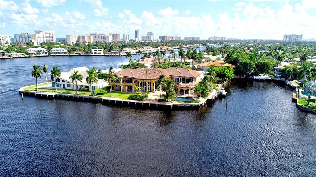 AWARD WINNING MAGNIFICENT CUSTOM POINT LOT. 260 FT WATERFRONT ON HUGE LAKE SANTA BARBARA. WATCH THE FORT LAUDERDALE BOAT SHOW AND POMPANO BOAT SHOW OFF YOUR PRIVATE DOCK. LARGE EXPANSIVE SPACES WITH 6 BEDROOMS ALL WITH EN-SUITE BATHS, CUSTOM BUILT WATERFRONT OFFICE, UPSTAIRS BILLIARD/GAME LOFT. HUGE MASTER BEDROOM WITH WALK OUT PATIO WITH VIEWS TO THE OCEAN! GREAT ENTERTAINING HOUSE WITH LARGE BAR AND THEATRE INSIDE AND HUGE OUTDOOR KITCHEN & ENTERTAINING AREA OUTSIDE WITH AN INFINITY EDGE POOL. DO NOT MISS THIS TURN KEY OPPORTUNITY TO OWN THE CUSTOM GEM OF NORTH BROWARD. BUILDERS ASSOCIATION OF SOUTH FLORIDA ''BEST IN SHOW'' & ''SPECIAL JUDGES AWARD FOR INTERIOR DESIGN!''