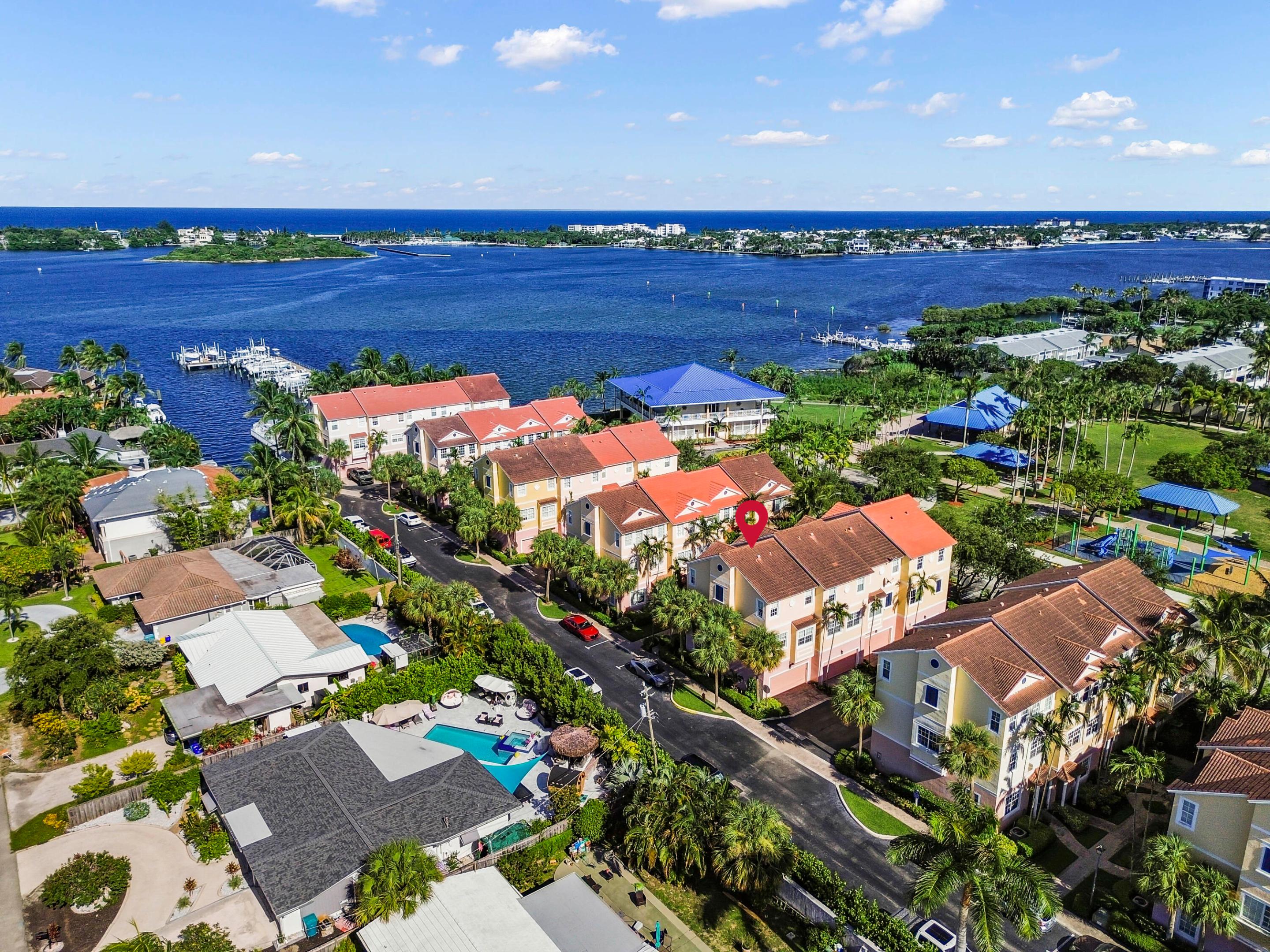 Welcome to 131 Harbors Way, a spacious 3 bedroom, 4 bath townhome with a first floor bonus room and bath that can act as an extra bedroom offering 1,599 living square feet in The Harbors, a desirable gated waterfront community in Boynton Beach. Its thoughtfully designed multi-level layout provides a comfortable balance of open gathering areas and private living spaces, while the private 2 car garage offers convenient parking and additional storage. The main living level feels bright and welcoming, with plenty of room for relaxing, dining, and entertaining. The kitchen is conveniently positioned near the living and dining areas, creating an easy flow for everyday life and hosting guests. Neutral finishes provide a versatile backdrop, allowing the next owner to personalize each space and make the home their own.  The primary suite offers a relaxing retreat with a private bathroom, while two additional bedrooms provide flexibility for family, visitors, a home office, or a hobby room. Beyond the home, residents can enjoy the community's waterfront setting and pool overlooking the Intracoastal Waterway. Conveniently located near beaches, boating, shopping, dining, and everything Boynton Beach has to offer, this townhome presents an inviting opportunity to enjoy the South Florida lifestyle.
