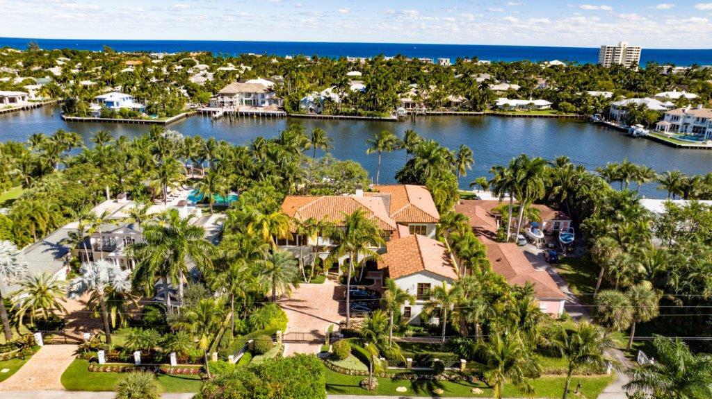 This custom-built Spanish Colonial-style Delray Beach estate is the epitome of palatial grandeur, set within enchanting lushly landscaped gardens, with interiors detailed by reclaimed flooring from a French villa, handsome wood-beamed ceilings and custom millwork throughout. Perfect for water-sports enthusiasts, with 102 +/- feet directly on the Intracoastal, the dock is fitted with three boat lifts.The information herein is deemed reliable and subject to errors, omissions or changes without notice.  The information has been derived from architectural plans or county records. Buyer should verify all measurements. 333 Palm Trail, Delray Beach, Florida: The desirable Palm Trail neighborhood is perfectly located, just minutes  from Delray Beach's award-winning sand-carpeted beaches, as well as vibrant Atlantic Avenue's boutique shopping dining and nightlife. It is barely 20± minutes from Boca Raton's private executive airport, and an easy 30± minute commute to Palm Beach International Airport.

PROPERTY: 
 
On more than a tropically landscaped half-acre, a new brick-paved drive leads through the gated entry to the motor court and front porch of this impressive residence, and in the turf-carpeted backyard, a large salt-water pool, hot tub, and pool house, with a cabana bath and built-in bar, invites outdoor entertaining. Perfect for water-sports enthusiasts, with 102 +/- feet directly on the Intracoastal, the wood dock is decked out with three boat lifts: one that can accommodate a 20,000-pound watercraft, a smaller lift that can hold a 5,000-pound watercraft, and a double jet-ski lift that can hold 7,000 pounds.

RESIDENCE:  

This fabulous Spanish Colonial-style, six-bedroom, custom-designed estate, with 12,914 +/- total square feet, features handsome wood-beamed ceilings and clay-tile flooring that was reclaimed from a French villa. Impressive and inviting, one is immediately immersed in the beauty and serenity of the Intracoastal Waterway from the reception foyer and grand stair hall. A welcoming fireplace beckons in the living room, and, perfect for enjoying pleasant breezes, the adjoining sunroom opens to the pool and patio with the Intracoastal as its scenic backdrop. The Intracoastal-view library features wood flooring, a wood-beamed ceiling, and handsome built-in cabinetry, while the formal garden-view dining room connects via a butler's pantry and wine room to the Intracoastal-view breakfast room, family room and center-island kitchen, which is fitted with custom wood cabinets, granite counters, tile back splashes, two pantry closets, a menu station, and professional-grade appliances. Also on the first floor is a guest bedroom suite that could serve as an office. Upstairs, French doors from the primary bedroom suite open to a balcony overlooking the pool and intracoastal, and the suite's dressing area accesses a large walk-in custom-fitted closet and two spa-inspired luxury bathrooms, one with French doors that open to a private sunroom. Two guest bedroom suites and a VIP suite complete the second-floor layout. The guest house is accessed via a hallway from the main house or by its separate entry, and the garage accommodates three cars. Additional amenities include impact-glass windows and doors, full-house generator and water softener systems, a Creston system, two 75-gallon hot-water heaters, central vacuum system, two laundry rooms in the main house, and a washer and dryer in the guest house. 

DISCLAIMER: Information published or otherwise provided by the listing company and its representatives including but not limited to prices, measurements, square footages, lot sizes, calculations, statistics, and videos are deemed reliable but are not guaranteed and are subject to errors, omissions or changes without notice. All such information should be independently verified by any prospective purchaser or seller. Parties should perform their own due diligence to verify such information prior to a sale or listing. Listing company expressly disclaims any warranty or representation regarding such information. Prices published are either list price, sold price, and/or last asking price. The listing company participates in the Multiple Listing Service and IDX. The properties published as listed and sold are not necessarily exclusive to listing company and may be listed or have sold with other members of the Multiple Listing Service. Transactions where listing company represented both buyers and sellers are calculated as two sales. The listing company's marketplace is all of the following: Vero Beach, Town of Orchid, Indian River Shores, Town of Palm Beach, West Palm Beach, Manalapan Beach, Point Manalapan, Hypoluxo Island, Ocean Ridge, Gulf Stream, Delray Beach, Highland Beach, Boca Raton, East Deerfield Beach, Hillsboro Beach, Hillsboro Shores, East Pompano Beach, Lighthouse Point, Sea Ranch Lakes and Fort Lauderdale. Cooperating brokers are advised that in the event of a Buyer default, no fee will be paid to a cooperating Broker on the Deposits retained by the Seller. No fees are paid to any cooperating broker until title passes or upon actual commencement of a lease. Some affiliations may not be applicable to certain geographic areas. If your property is currently listed with another broker, please disregard any solicitation for services. Copyright 2023 listing company All Rights Reserved