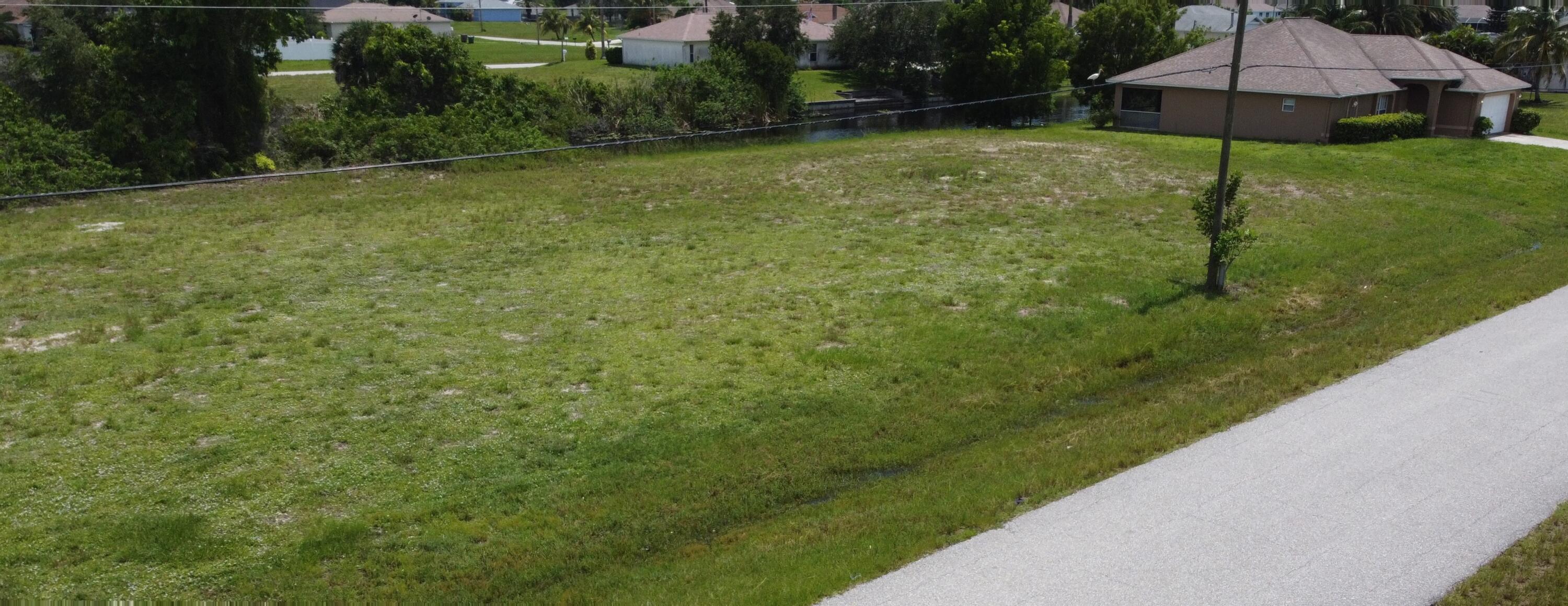 Attention Builders, Developers, and Agents!

Your next project awaits! This prime lot offers an exceptional opportunity to build a beautiful single-family home in a desirable Cape Coral neighborhood. Per the previous owner, the builder prepared an area tabulation with the following approximate measurements: 1,718 sq ft living, 435 sq ft garage, 157 sq ft lanai, and 37 sq ft entry, totaling 2,347 sq ft (buyer to verify).
A 2005-built seawall is already in place—an excellent advantage for waterfront construction.

Cape Coral is one of Florida's fastest-growing cities, celebrated for its stunning beaches like Sanibel Island, picturesque parks, dog-friendly trails, and unmatched coastal lifestyle. Don't miss this opportunity. Lot Sold ''AS IS.''