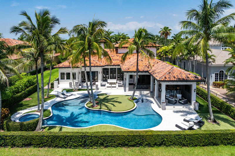 Discover an extraordinary custom luxury estate designed for sophisticated living and grand-scale entertaining. Highlights include 9" European espresso French oak flooring, a designer chef's kitchen with a full Viking Professional appliance package, Sub-Zero refrigeration, Bosch coffee system, oversized quartzite island, and a climate-controlled 1,000-bottle wine room. Enjoy seamless indoor/outdoor living with NanaWall doors opening to a resort-style backyard featuring a heated beach-entry pool, raised spa, outdoor kitchen, pizza oven, Big Green Egg, and covered loggia. Additional amenities include a private theater, home gym, executive office, luxurious primary suite, Generac full house generator, air-conditioned garages, Pella windows, and professionally designed landscaping.