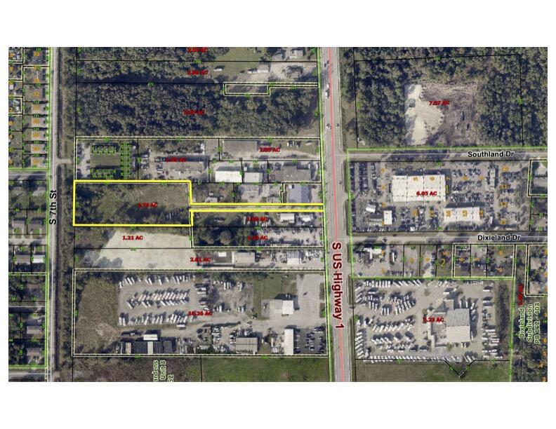 Protected, private 2.76 acres with access off US1, zoned Light Industrial for many, many uses! Great Location in busy commercial US1 location.