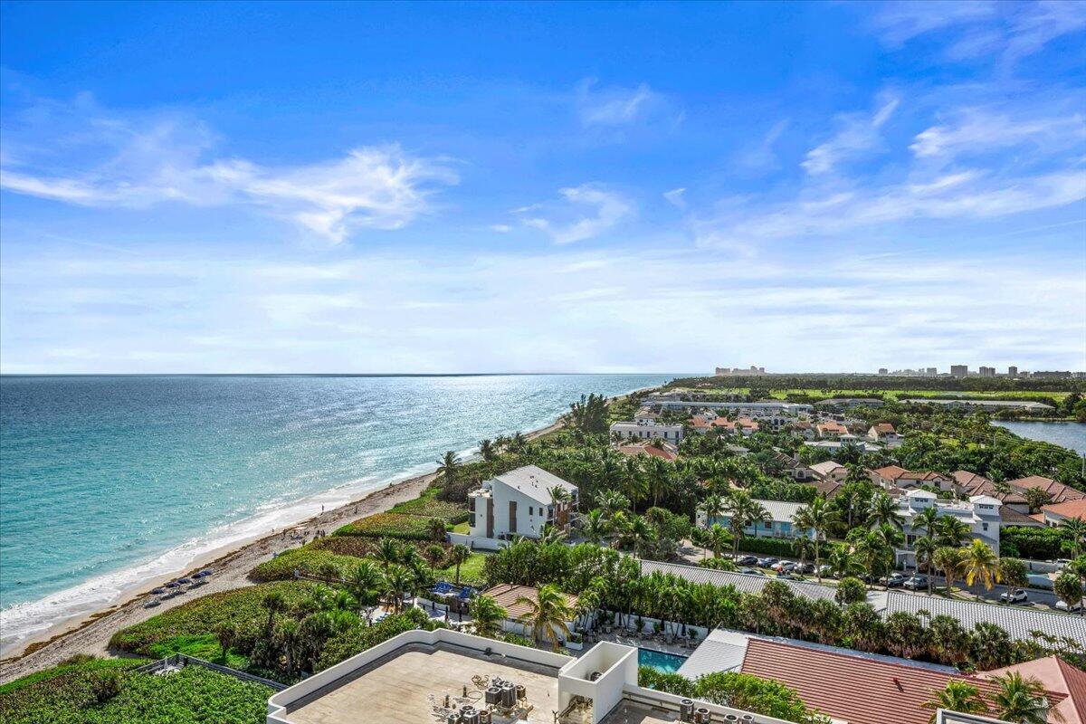 Perched atop the building, this exceptional top-floor penthouse offers breathtaking, unobstructed ocean and city views. This rare south-facing residence captures stunning sunrises over the Atlantic and glowing sunsets to the west, filling the home with natural light throughout the day. Completely renovated, this direct oceanfront condo features superior finishes, light-up crown molding, and an open layout designed to maximize panoramic views. The chef's kitchen offers a spacious island for preparation and entertaining, plus a bar area with a wine fridge. Spa-inspired bathrooms include a rainfall shower system with handheld, and a custom dual-entry walk-in closet in the primary suite. An elevated setting offers privacy, serenity, and a year-round vacation lifestyle.