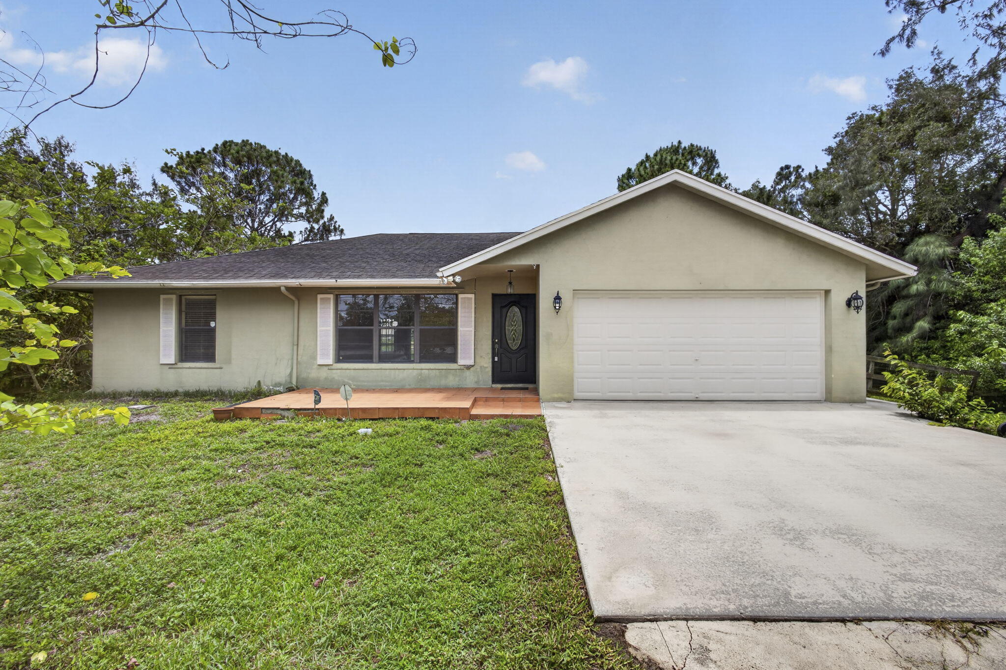 Welcome to this charming single-story residence in unincorporated West Palm Beach, Florida. This three-bedroom, two-bathroom home offers 1,532 square feet of comfortable living space, making it an efficient and practical choice for those seeking a compact home. The two-car garage provides convenient vehicle storage and protection from the elements. Situated on a single level, this layout eliminates the need for stairs and ensures easy accessibility throughout the home. This straightforward, well-organized property presents an excellent opportunity for buyers looking for solid, no-nonsense residential living in the West Palm Beach area.