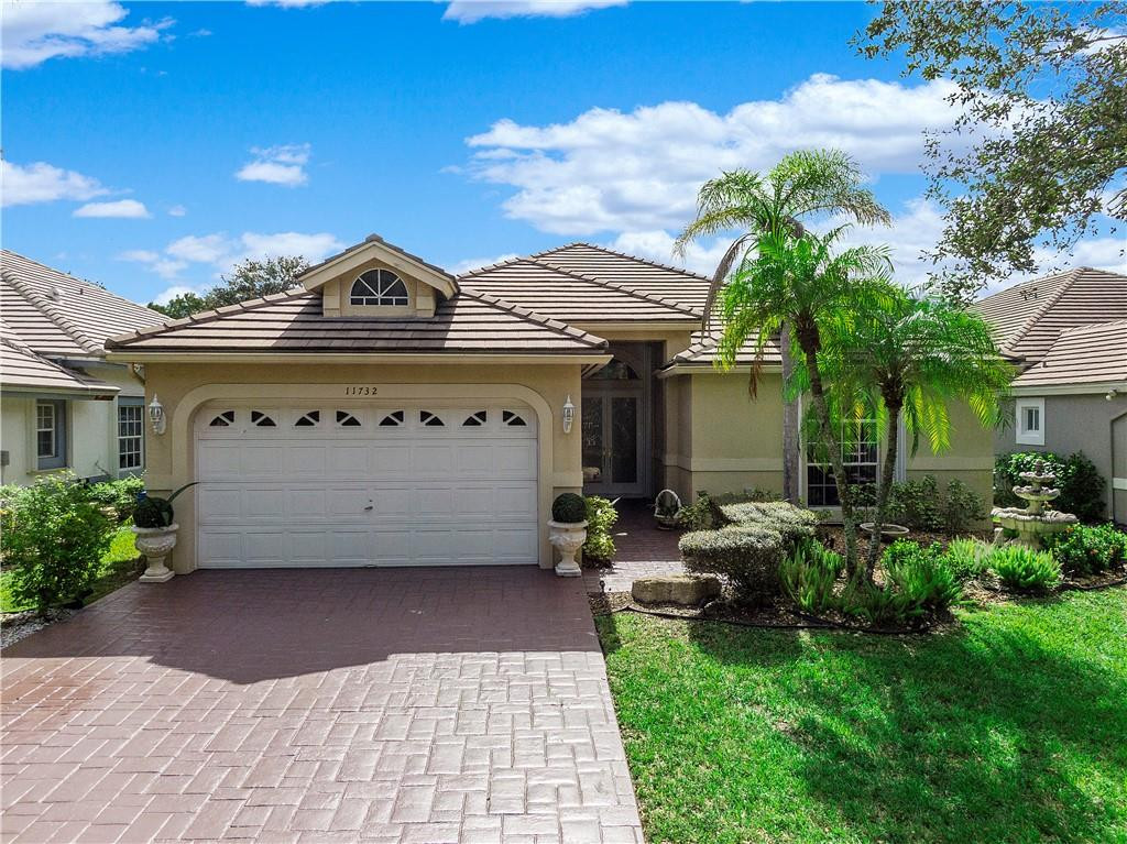 This beautifully maintained home is located on a tranquil water lot in one of Coral Springs most sought after gated communities! Features include a double door foyer entrance, a bright open floor plan, formal living & dining rooms, family room, breakfast area, volume ceilings, custom built-ins, plant shelves, recessed lighting & a central vacuum system. The spacious kitchen offers white cabinets, white appliances & a separate built-in bar. Entertain family and friends in the screened patio or swimming in the tropical pool! Accordion Hurricane shutters! Great location & great area schools! This is South Florida Living at its best!
