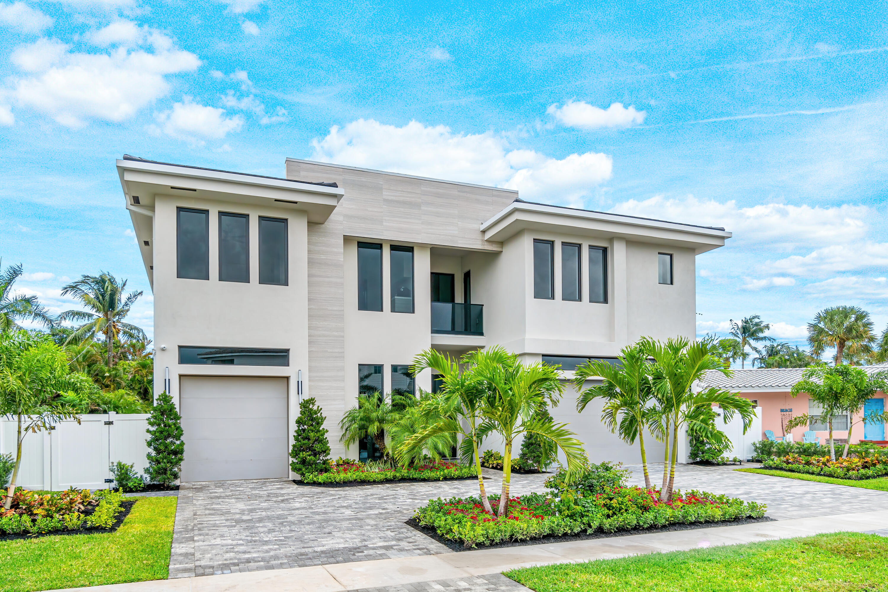 An Architectural masterpiece by Alpha Premium Development, within walking distance to Mizner Park, 20th Street Shops and Lake Wyman Park.  This contemporary home has it all, Five bedrooms, plus club room and office. Expansive gourmet kitchen with professional series Wolf & Subzero appliances, and quartz counters. Downstairs features an ensuite bedroom, club room and office, and an expansive living room with 22' ceilings! 
Upstairs, four suites plus a media loft overlook wide open windows and bright spaces. A North-facing backyard with saltwater pool and plenty of space to relax and entertain. Quality CBS construction with high-end finishes, custom cabinetry, impact windows, doors, full house generator, and so much more.