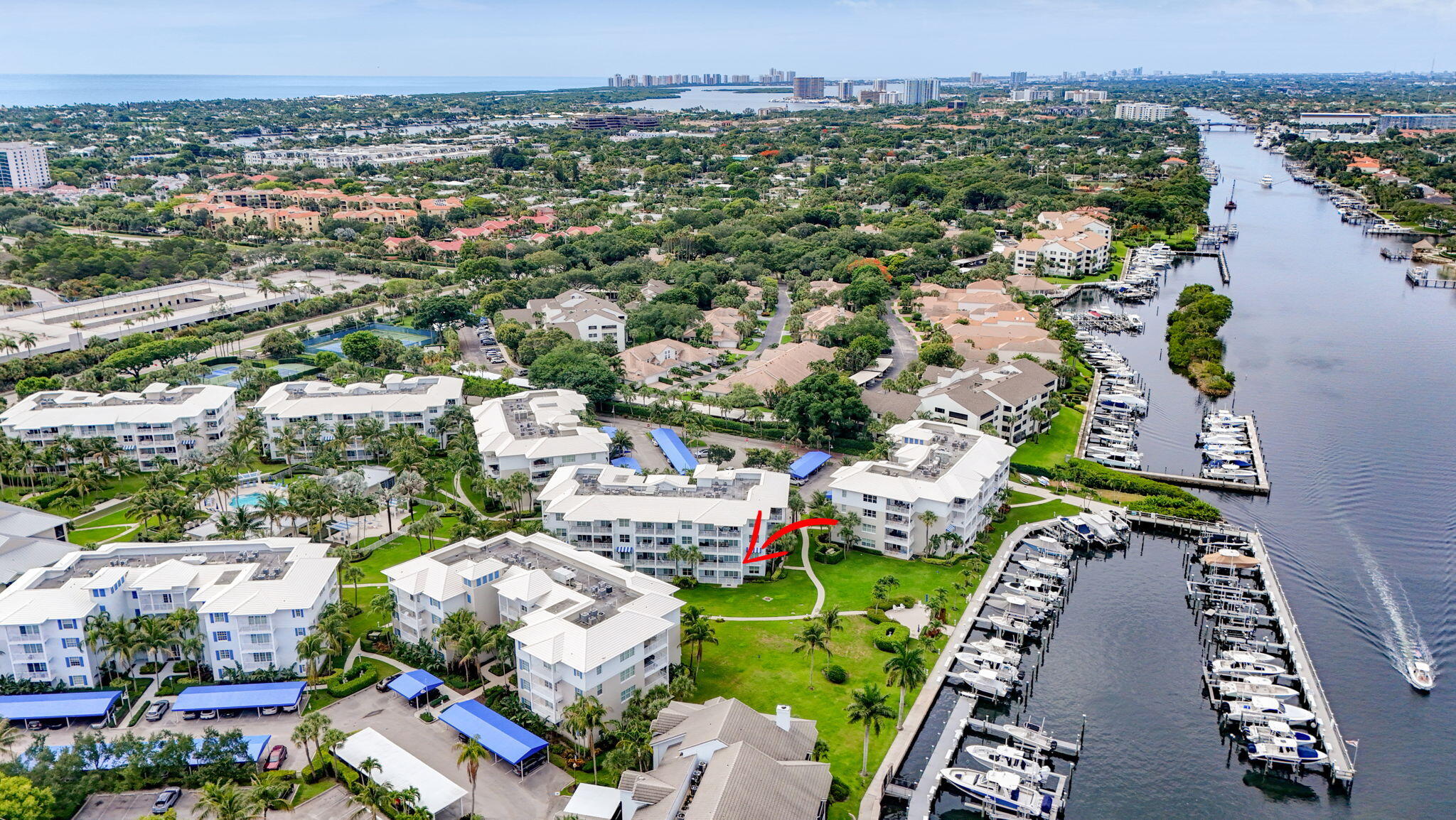 Along the Intracoastal Waterway is the beautiful community of Bay Colony in Juno Beach. Step inside this well maintained and thoughtfully designed first floor, 3 bedroom, 3 bath residence. Impact glass throughout. Two covered patios overlooking a large green space and the private Marina. Open floor plan with SS appliances and granite countertops with a breakfast bar. Third bedroom is opened as a den/office. Spacious primary with a large bathroom am a walk-in closet. Resort style Pool and Spa Area with a beach chic Community Room and a Fitness center. Large seating area with fire pit. Tennis, Pickle ball and bocce ball courts. Kayak/paddleboard storage and launch. Wake up every morning to the amazing views this unit affords. Luxury Waterfront living in Juno.