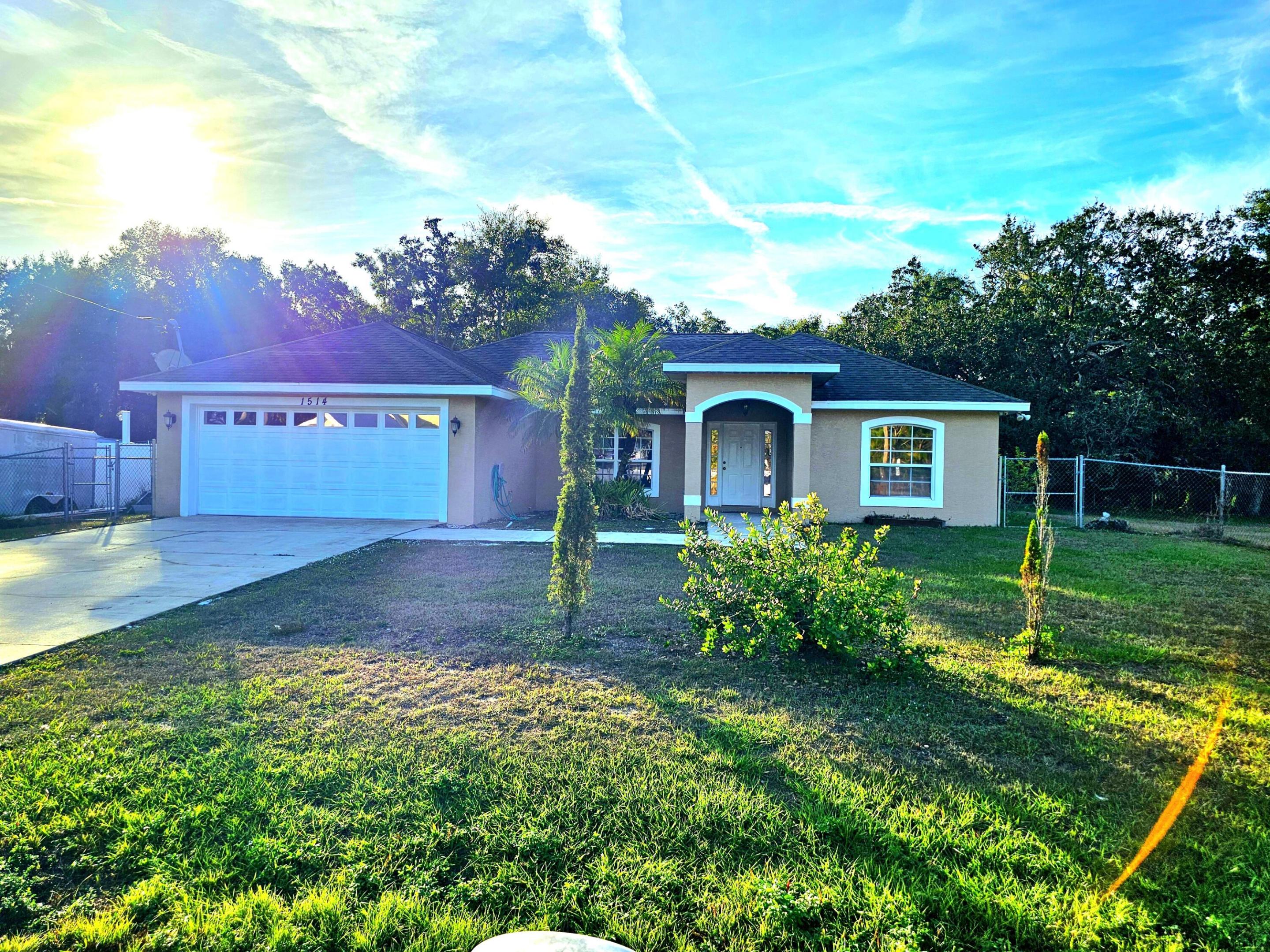 Charming~ CBS 4-bedroom, 2-bath home with 2-car garage in a great location and NO HOA! Sits on 0.43 Acres. This property offers a spacious split floor plan with ceramic tile throughout and generously sized rooms. Enjoy peace of mind with a water well featuring an excellent softener system, reverse osmosis, and septic. Home includes stainless steel appliances (2019), an A/C with a new compressor installed in 2021, and fresh interior paint. An alarm system with cables and connections is already in place. The property is fully enclosed with chain-link fencing and also features an additional water well and pump with 5 sprinklers for irrigation~perfect for keeping the yard lush. High and dry location. Call for a free tour today!