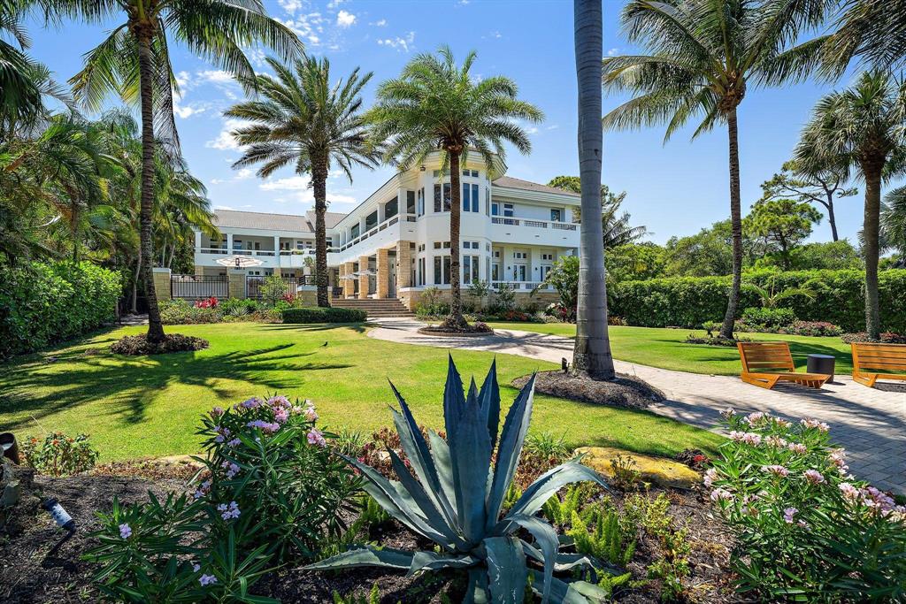 Stunning + palatial  modern Intracoastal home with over 9,300 interior SF and 106' of direct deepwater frontage!  Newly renovated to blend aesthetic simplicity w/ state of the art functionality this home offers a new approach to healthy living.  A private gate leads to this sprawling and lush 1.4 acre estate just minutes from the Jupiter inlet.  Organic design elements include marble + wood flooring, stone accent wall w/ fireplace and floor to ceiling windows (all premiere impact).  A 2 level living room welcomes you into this spacious home.  All rooms are grand in size, blending casual comfort + elegance.  Family room + kitchen w/ water views are the hub of this inviting home.  Owners suite offers resort luxury w/ spa style bath + massive closets.  Additional rooms include a huge home gym and a large pool cabana w/ kitchen.  Guest BR's are all grand in size and feature spa-like ensuite baths.   Upper floor enjoys a spacious outdoor lanai area with views of the pool and Intracoastal waterway, along with tropical breezes.   If laid back luxury is what you desire, this is the home for you.  From the enchanting (and private) manicured grounds to the incredible interior square footage and easy boating options, this Florida home has it all!  Beautifully located within minutes of best beaches, shopping, dining and golf venues, conveniently by the Palm Beach Gardens/Jupiter line.   Close to 3 major airports, Palm Beach Island... you will Love living here!
