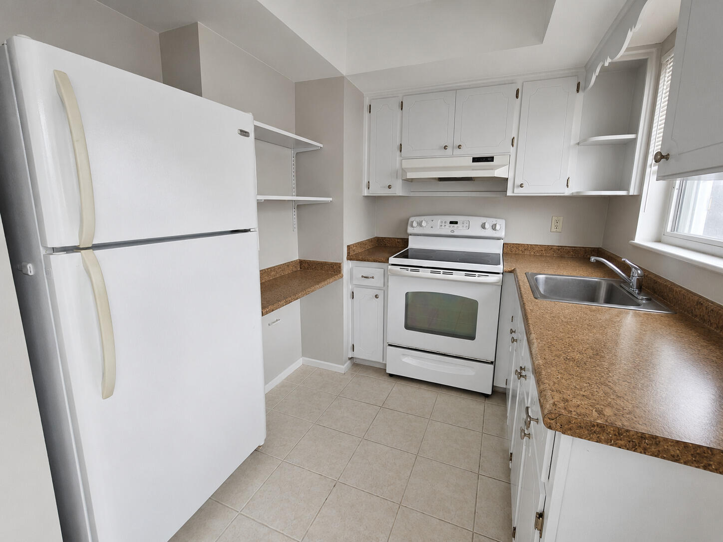 Enjoy this charming 1-bedroom, 1-bath rental in the heart of Lighthouse Point! This desirable corner unit is filled with natural light and offers the convenience of assigned parking just steps from your front door, along with a private back patio perfect for relaxing outdoors. Inside, you'll find hard surface flooring throughout, fresh paint, and a spacious living area that flows seamlessly into the dining space and kitchen. An impact sliding glass door leads to your secluded patio retreat. The oversized primary bedroom features a large walk-in closet, additional hall linen storage, and plenty of space to unwind. Coin laundry is conveniently located within the building. Ideally situated close to parks, shopping, dining, transportation, and all that Lighthouse Point has to offer.