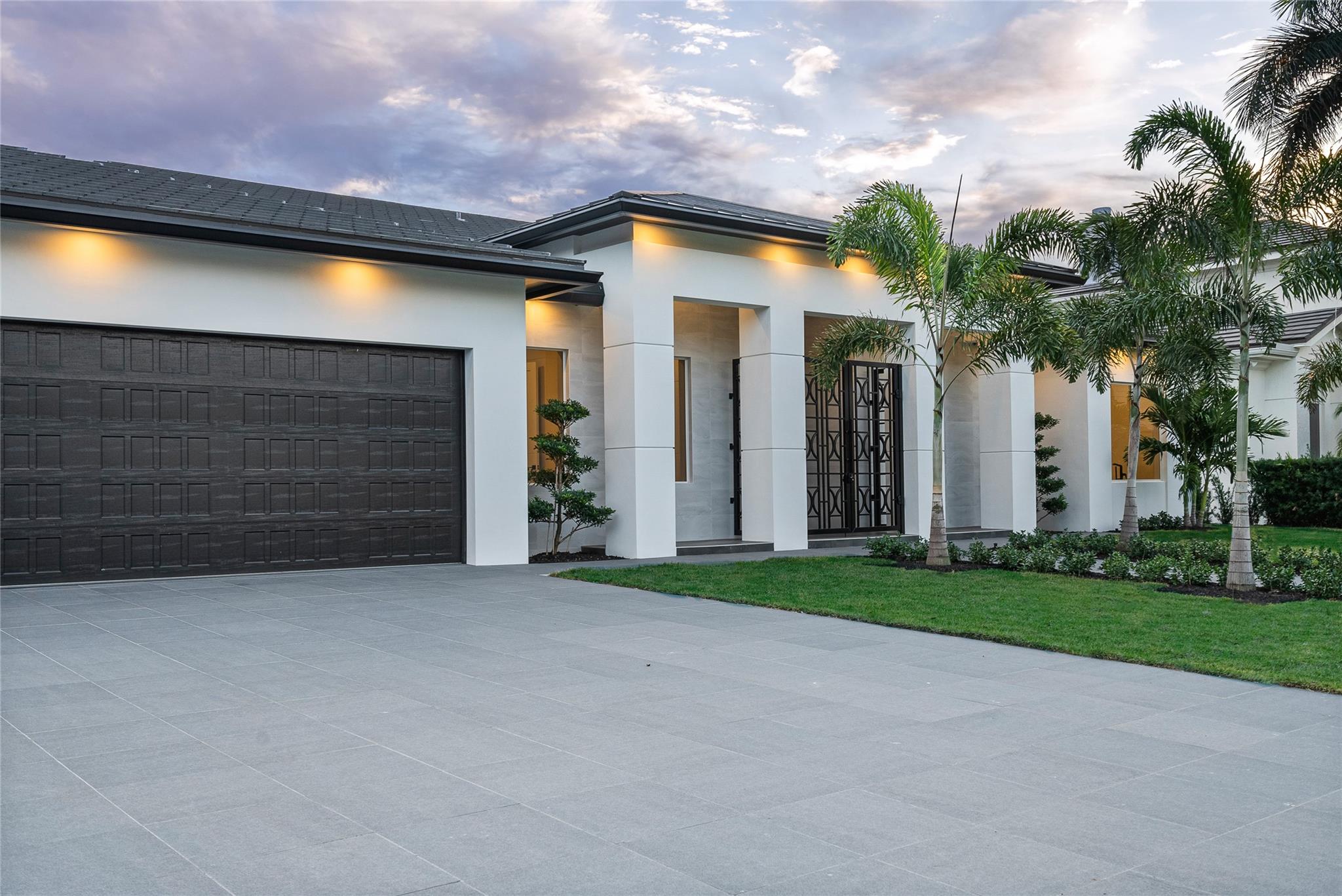 This brand new, high ceiling, single story masterpiece less than 5 mins to the inlet is the home that you have dreamed of! Designed by it’s discerning owners as their own residence it is now available for sale. This magnificent residence boasts the perfect split floor plan 3 beds + an office and 3.5 baths as well as a 3 car garage. Huge owner's suite! Designer kitchen with high-end appliances and a spacious pantry. Expansive covered lanai with ample room for seating + dining groups as well as a stunning outdoor kitchen. 100 foot concrete dock. The back of the home gives you sunny southern exposure.  The entire lanai, dock, and pool deck are covered in marble and surround the custom pool. Cabana bath and outdoor shower. This property has never been lived in and is sure to impress!