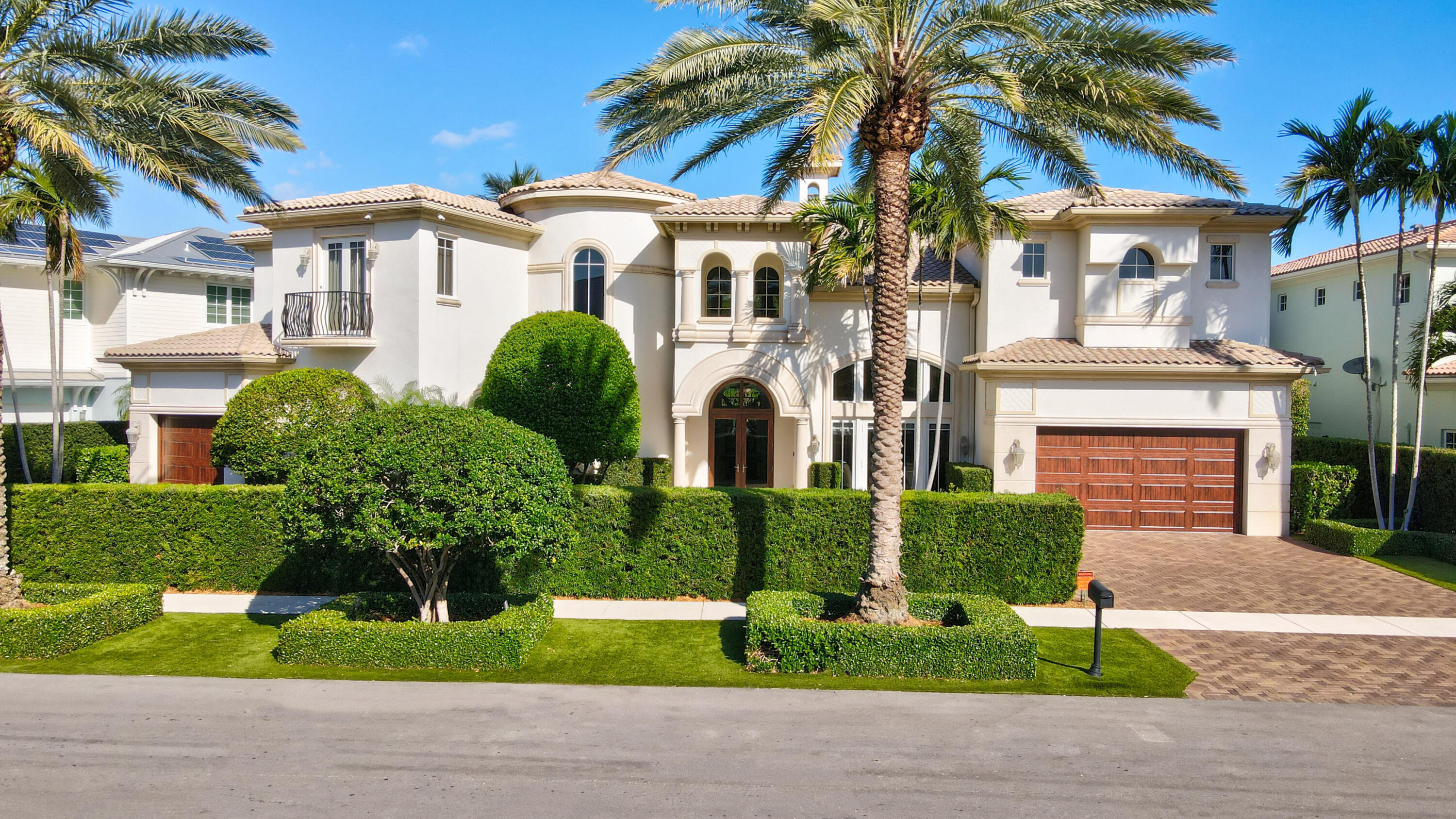 This exceptional 2-story residence is in move in condition is located within walking distance to Mizner Park, intracoastal waterway and Boca's beautiful beaches and parks as well as some of Boca Raton's finest restaurants. Double glass front doors open to a distinctive entry foyer, a two-story living room with cast stone fireplace and cast stone columns, spacious dining room and entertainment bar.Downstairs, there is a VIP guest suite, office and spacious kitchen  which was recently updated  features high end appliances. Additionally, the kitchen has a wonderful butler's pantry, also recently updated  and opens to a spacious family room and breakfast/dining area which completes the first floor. SEE MORE A second-floor primary suite is extraordinary with a connecting spacious sitting room, both opening to the exterior balcony, as well as a large  luxurious bathroom with separate dual sinks and water closets and a large circular bathtub and oversized shower with sitting areas.
 
Three additional suites and an open loft area complete the second floor. A covered exterior backyard patio with barbecue, overlooks the pool and patio which has been lushly landscaped to provide fabulous privacy and is perfect for year-round entertainment.

Impact glass throughout
paver circular driveway
room for an elevator