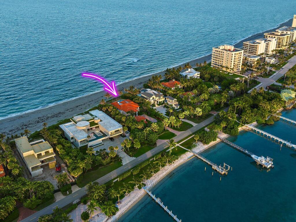RARE and EXCEPTIONAL blend of beachfront elegance, coupled with the highly sought after Jupiter Island vibe that you've been searching for. 613 S Beach represents the best of both worlds, sitting directly on the sand on the exclusive Jupiter Island beachfront, while maintaining a casual tone with its deeded Intracoastal Waterway water frontage, boat dock, and lift. This luxurious retreat has been fully furnished and is fully equipped to make your South Florida stay effortless. Featuring an open, airy floor plan with five large bedrooms in the main home, each with a generous walk-in closet and large ensuite bathroom, plus an office or den in the main house, AND a detached large one-bedroom guest house! [click for more] The entire property boasts pride of ownership, with impeccable millwork, intricate carpentry and stunning tile flooring, creating an ambiance of refined beauty, while feeling like an intimate beach house all the same. The main house features a thoughtfully designed floorplan, catering to households of all sizes and with that highly sought after indoor-outdoor flow between the interior living spaces, the expansive pool deck, and the beach access beyond.

Step outside to your piece of Jupiter Island paradisea sprawling beachfront haven, anchored by the property's lush landscaping, sparkling pool, all against the breathtaking backdrop of the Atlantic's endless blue horizon.

This exceptional residence is ready to become your private oasis. Enjoy the vibrance that Jupiter has to offer, and revel in the exclusivity of this prestigious address.