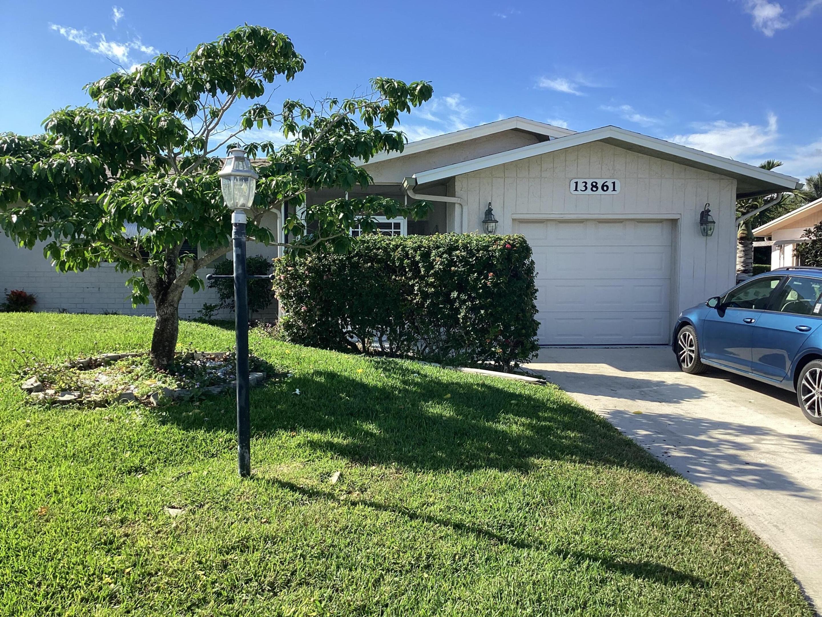 BEAUTIFUL lakefront home with recent NEW roof and full IMPACT windows. The updated OPEN kitchen with granite countertops, stainless steel appliances and bi-level island flows into a living room with 2 NEW skylights. Large den with lots of natural light invites you to relax in comfort. Three distinct lanais provide a variety of ways to enjoy the Florida weather. Two of them feature NEW mini-split A/C units and NEW flooring effectively adding extra usable square footage to the home. The modern bathrooms sparkle with NEW glass shower doors. Master bedroom provides closets with CUSTOM wood shelving. Unique to these homes is a separate laundry room that includes a window for natural light, lots of storage space and an A/C vent for comfort. The popcorn FREE ceilings are adorned with crown moldin The popcorn FREE ceilings are adorned with crown molding and remote control ceiling fans. Outdoor patios with beautiful travertine tile will thrill you with stunning sunsets over a gorgeous lake view, framed by meticulously maintained landscaping. It is one of the most private and serene lots in the community. Enjoy a quiet cul de sac with the convenience of nearby shopping, dining, and recreational options. Walk to the pool and active clubhouse.The recent HOA assessment of over $2,800 per household providing for a NEW pool, tennis courts and clubhouse parking lot has already been PAID!!!