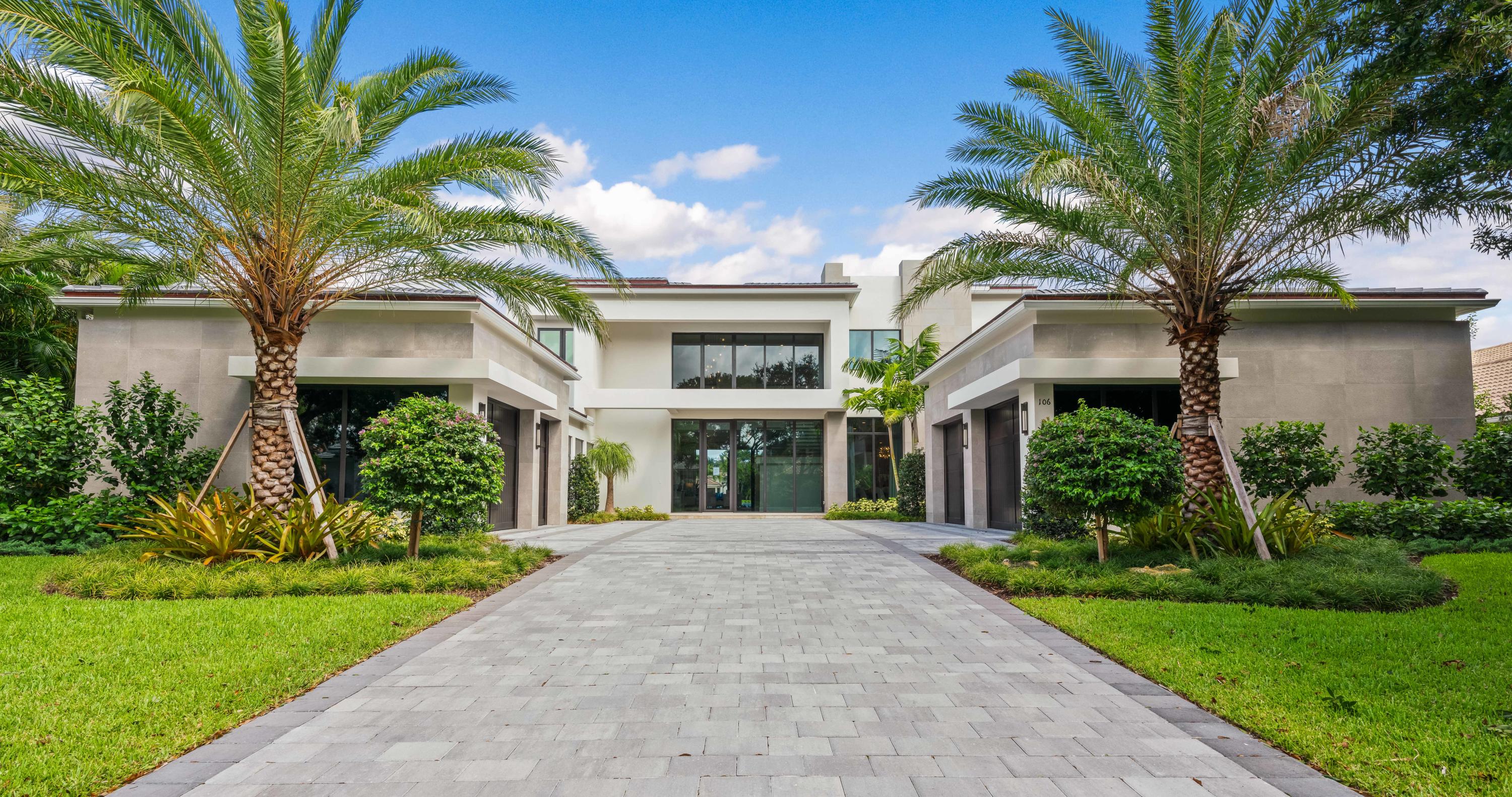 Nestled along the oak canopied street of Quayside in Admirals Cove lies this furnished, contemporary, new construction home ready for occupancy. Built by one of the area's top custom home builders, Hasey Construction made sure they paid incredible attention to every detail in this new masterpiece. From the moment you arrive, you will know that this custom waterfront residence is different from others you have seen in your lifetime.  The approach is elegant and timeless featuring storefront impact windows and doors, smooth concrete accents and solid wood garage doors. As you enter the foyer of this luxury estate, you'll find natural stone flooring throughout the main living areas, a wood veneered see-through gas fireplace perfectly situated between the formal living and family room... impeccable ceiling details, and a wall of glass along the back of the home which brings the outside, inside.  Off the family room you'll find a gourmet kitchen suitable for a culinary chef.  Precision mitered porcelain countertops, Sub Zero & Wolf appliances, fine milled cabinetry and designer plumbing fixtures. Downstairs you will find the master suite along with an enormous waterfront club room and an in-law suite.  

The oversized master suite is definitely fit for a king & queen with water and pool views, tremendous natural light, drapery pockets and closets that will be hard to fill, even for the most accomplished shopper.  Her master bath will not disappoint featuring white marble floors, free-standing contemporary tub, frameless glass shower, beautiful quartz vanity top, custom cabinetry and an elegant dressing area.  His bath is more masculine in appearance, but the fit and finish is second to none.  

This custom home is equipped with an elevator, but when you see the craftsmanship of the floating staircase, you may never want to ride.  Solid wood treads ensconced in glass and polished metal, the stairs in this custom home are the perfect combination of art and functionality.

Upstairs, both family members and guests will live in the lap of luxury.  Featuring an oversized loft, 3 ample guest bedrooms with ensuite baths, walk-in closets, large balconies and water views galore. 

If your ship has come in, this is where you will want to keep it. With 110ft of waterfront, a new custom dock will be the main feature outdoors.  The dock will have a lounging deck for entertaining, water, electric and room for up to a 80ft yacht.  Relax poolside in your custom heated pool and spa featuring automated controls, waterfalls and a sun shelf for splashing about.  Can you smell those tomahawk ribeyes cooking on the grill?  The outdoor living area provides for a well-appointed summer kitchen, ample room for outdoor furnishings and phantom roll down screens for added comfort.  This is the custom home of your dreams and you can have it now!
