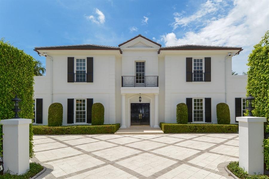 Palm Beach near north end!  Custom two-story traditional home on approximately a 16,300SF property with BR/7Ba.  Perfect for outdoor entertaining with east & west loggias, impeccable gardens with 45' x 15' pool.  Full house generator, 2-car garage, steps from the lake path and ocean access.