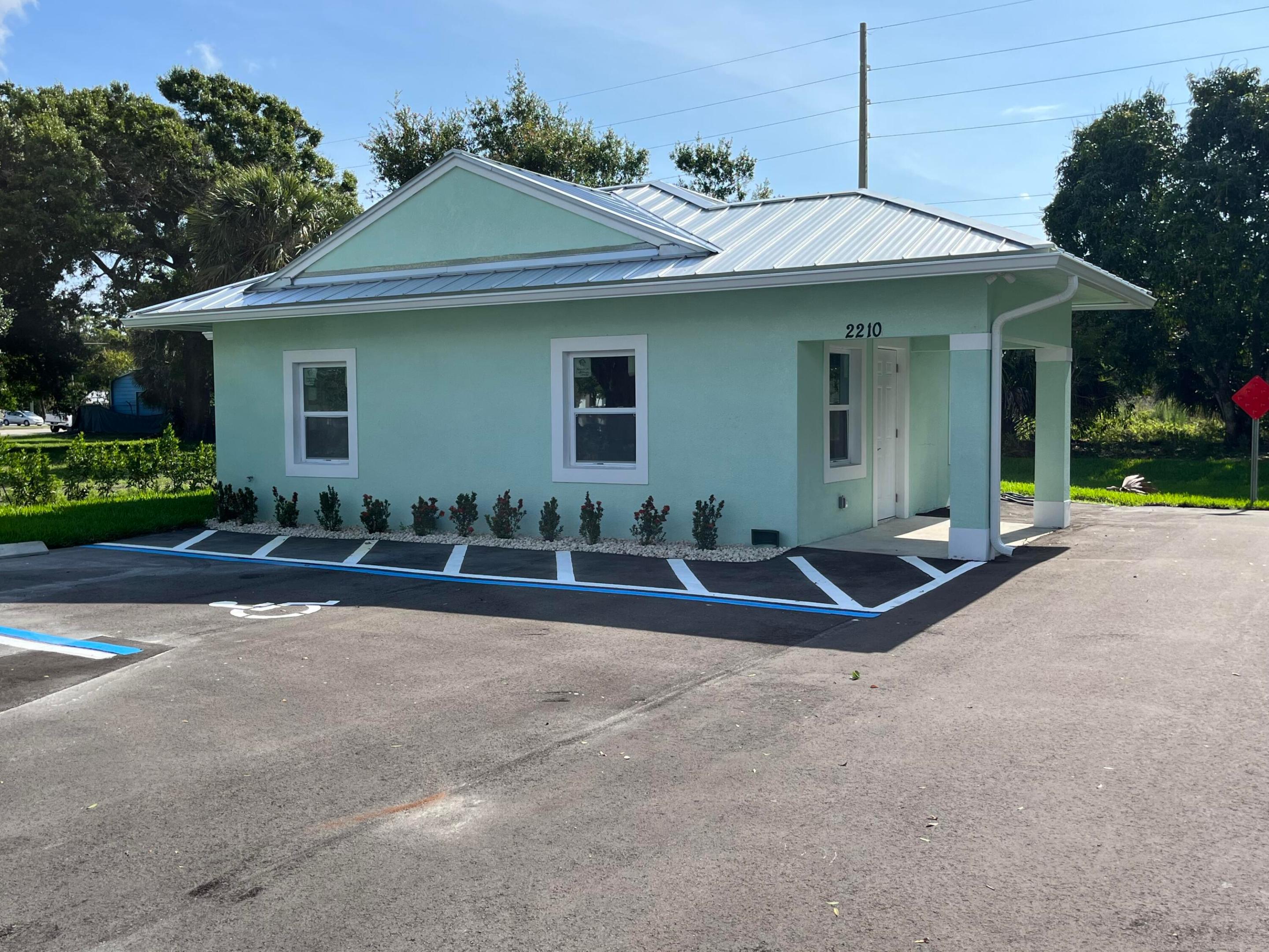 Premier office space available for lease. This free-standing building has been completely updated and remodeled, featuring impact windows and a durable metal roof. The interior includes a large, versatile multi-use area designed for multiple workstations, a private office, an ADA-compliant restroom, and an employee lounge. The property is ideally located west of town, just five minutes from I-95 and the Turnpike, and within walking distance of the iconic Moonswiners BBQ restaurant.